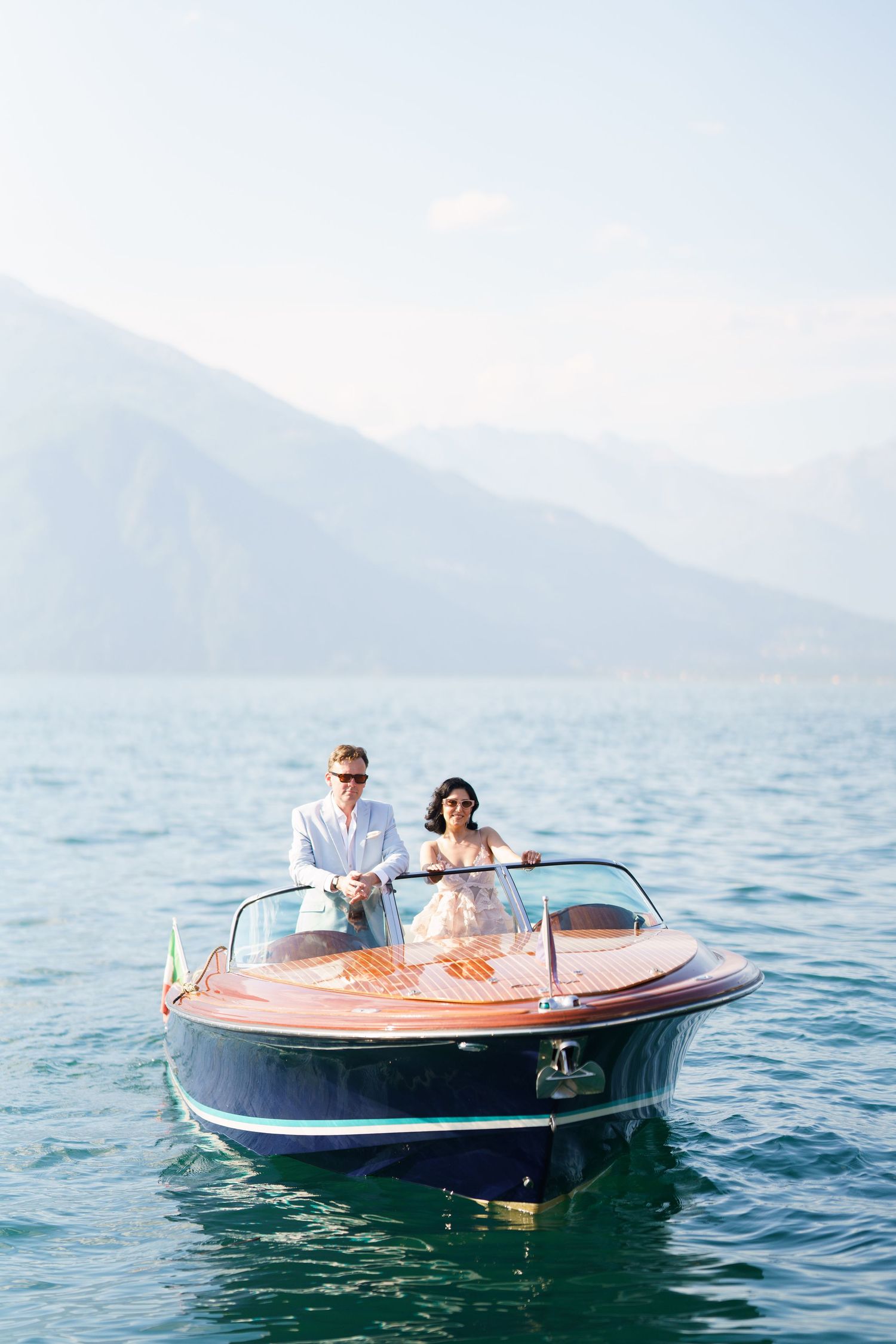 luxury lake como photoshoot with classic wooden boat