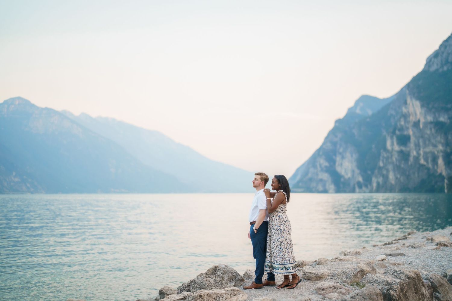 Emotional reaction during a surprise proposal beside Lake Garda in Riva del Garda