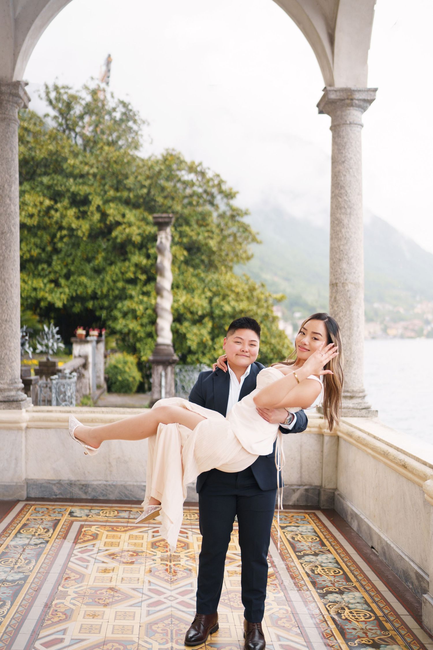 Lake Como proposal photographer capturing surprise engagement at Villa Monastero in Varenna