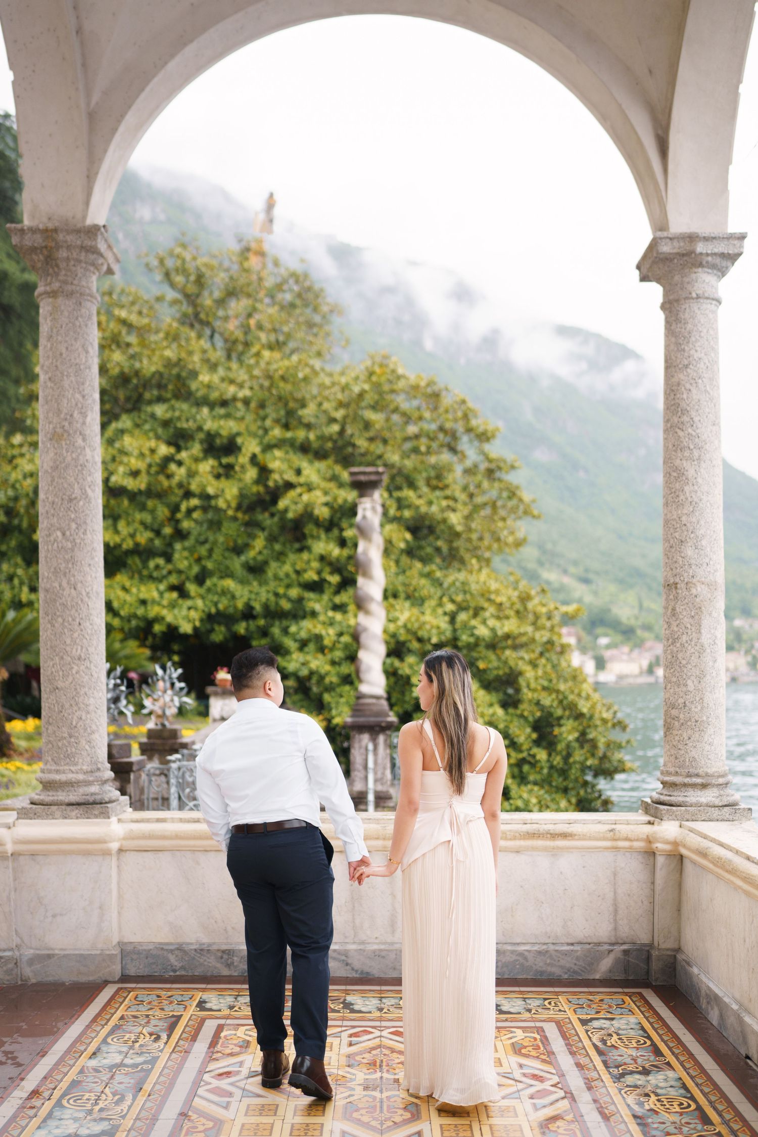 Lake Como proposal photographer capturing surprise engagement at Villa Monastero in Varenna