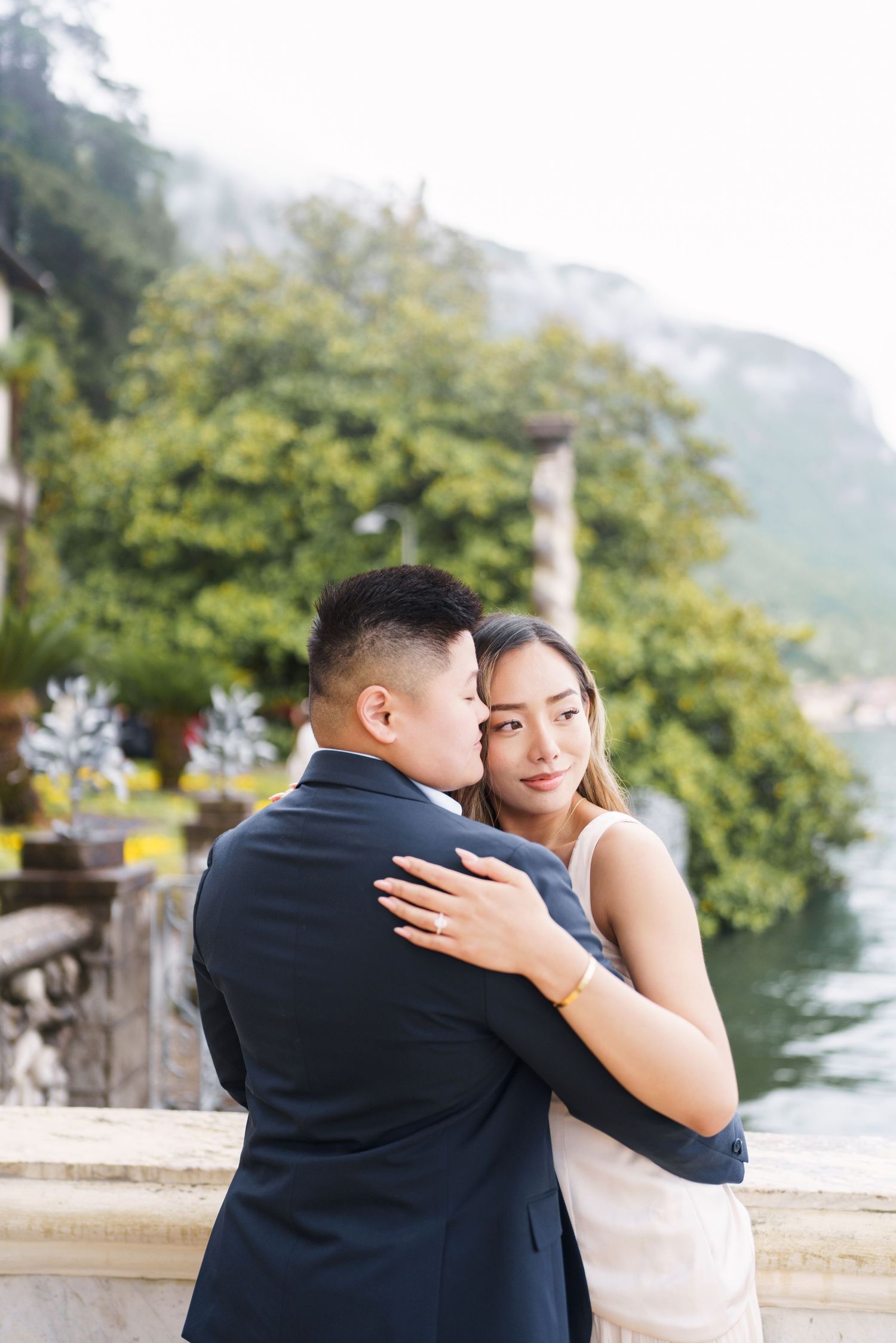 Lake Como proposal photographer capturing surprise engagement at Villa Monastero in Varenna
