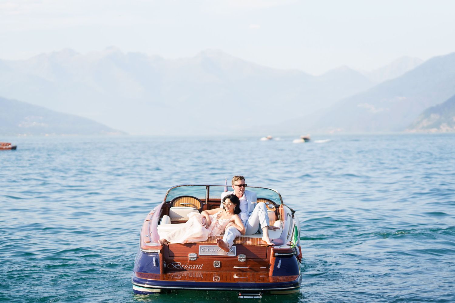 luxury lake como photoshoot with classic wooden boat