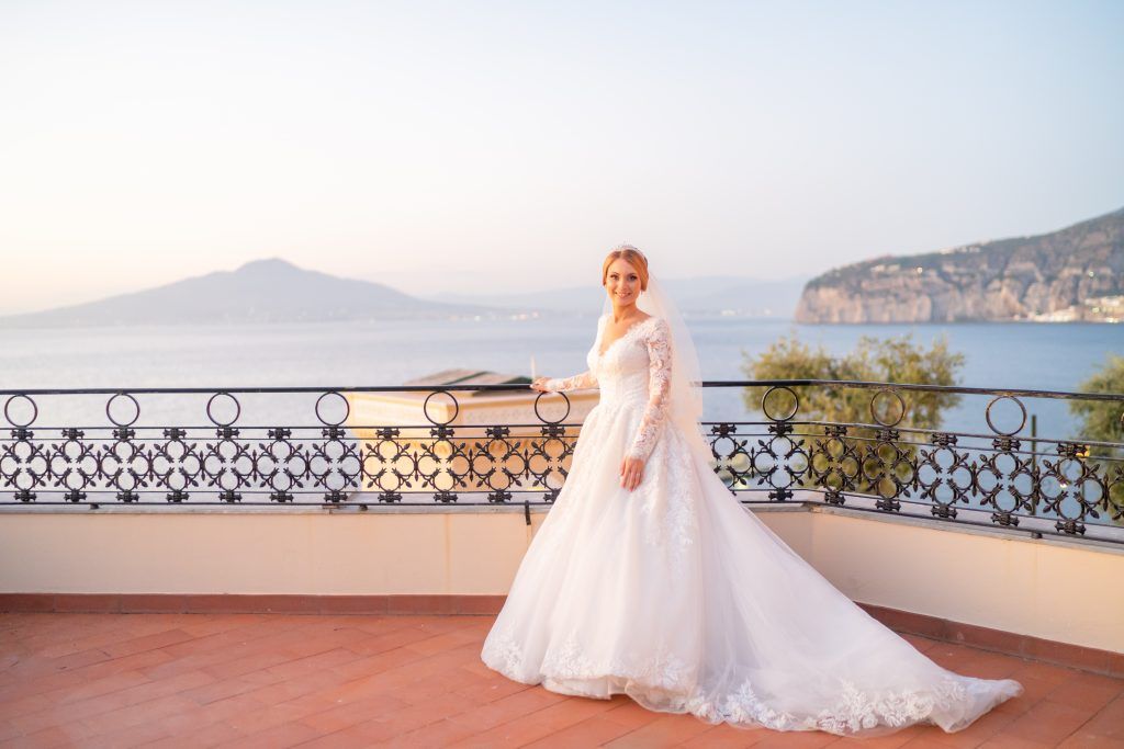 Romantic wedding photography session on an elegant terrace overlooking the Bay of Naples.