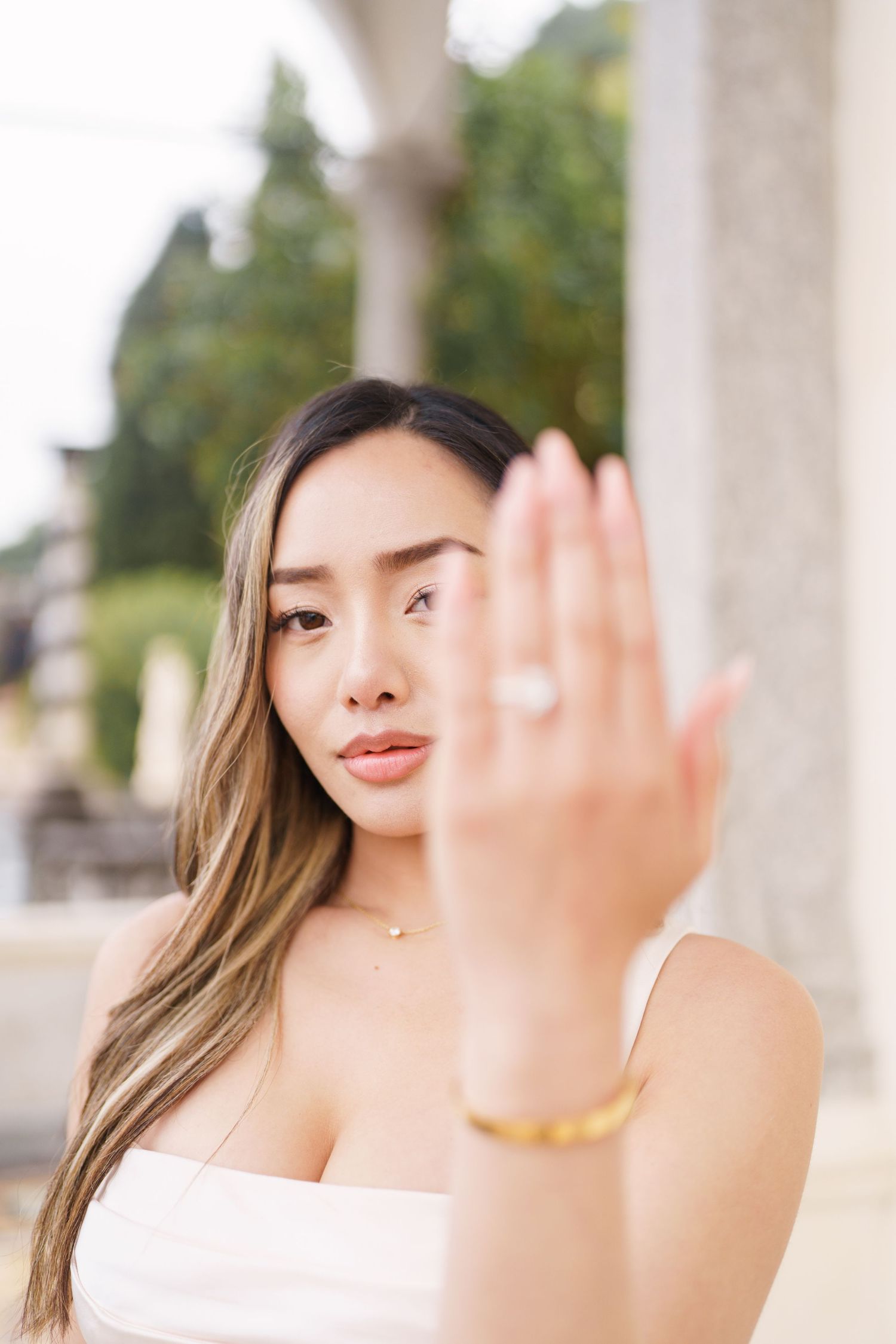 Lake Como proposal photographer capturing surprise engagement at Villa Monastero in Varenna
