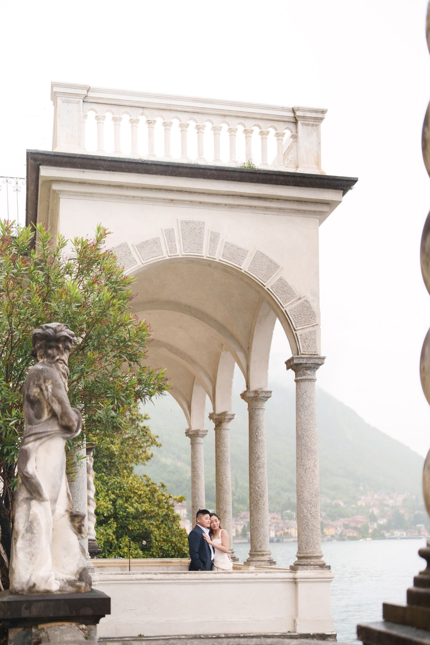 Lake Como proposal photographer capturing surprise engagement at Villa Monastero in Varenna