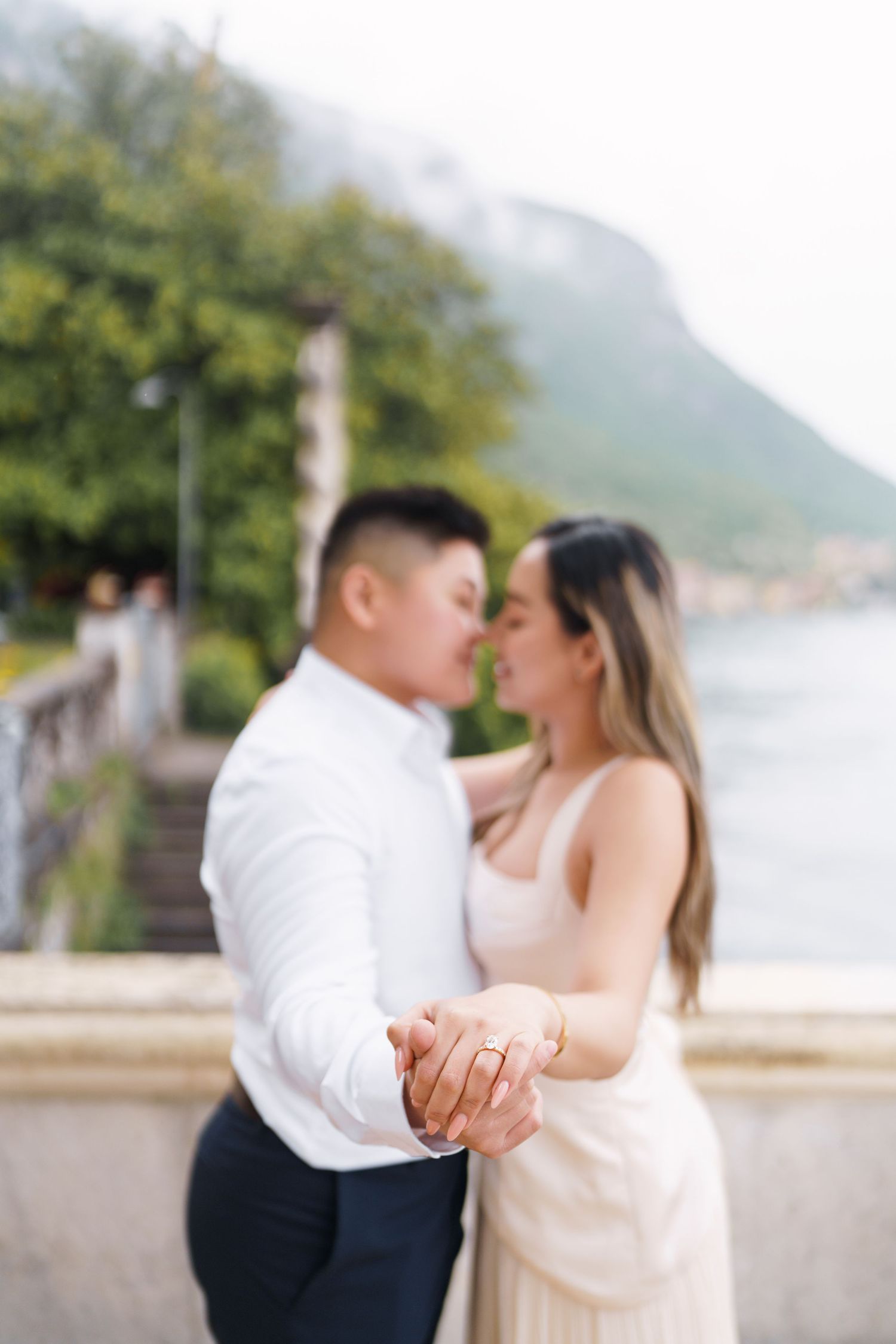 Lake Como proposal photographer capturing surprise engagement at Villa Monastero in Varenna
