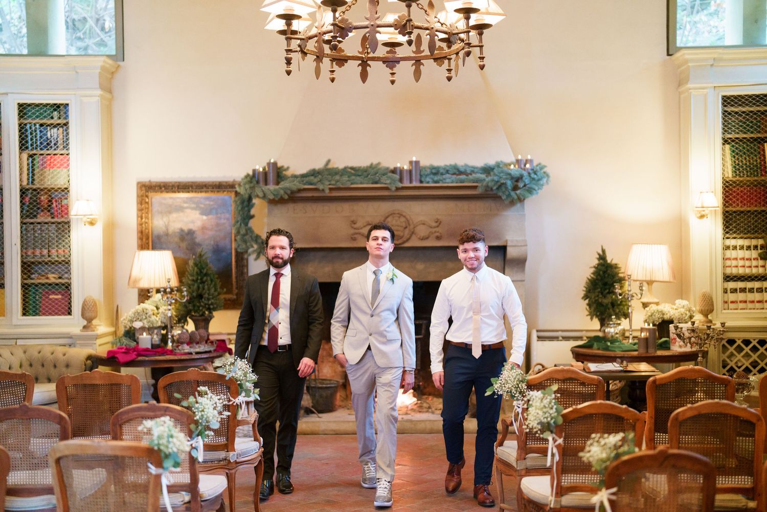 Elegant reception hall with chandeliers and traditional furnishings set for a wedding celebration.
