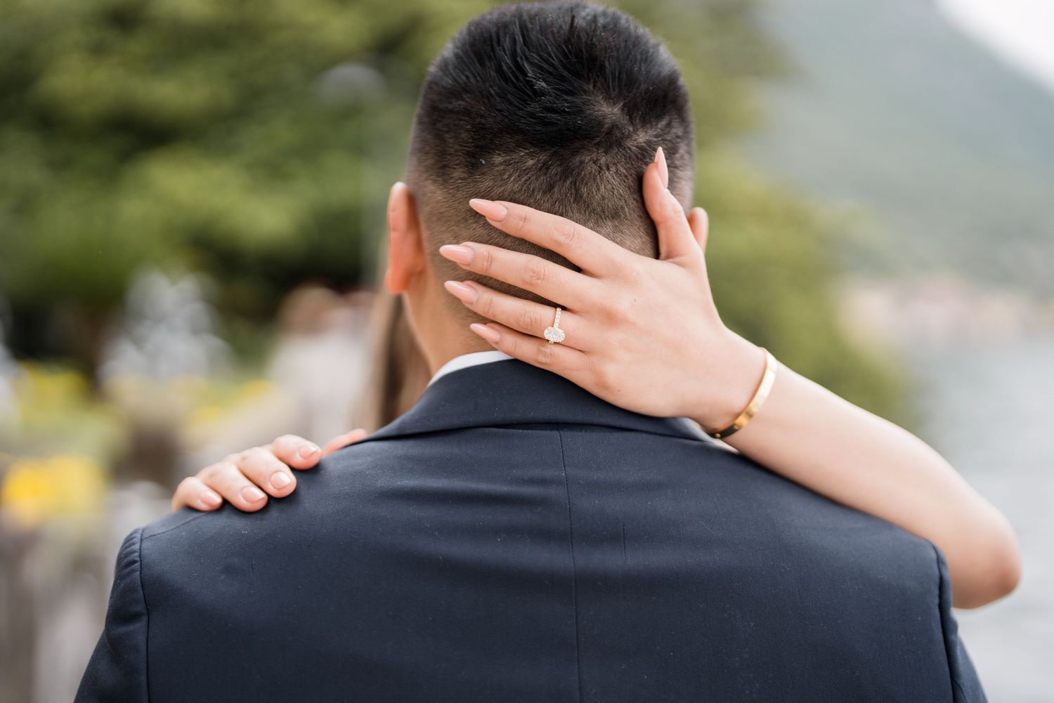 Lake Como proposal photographer capturing surprise engagement at Villa Monastero in Varenna