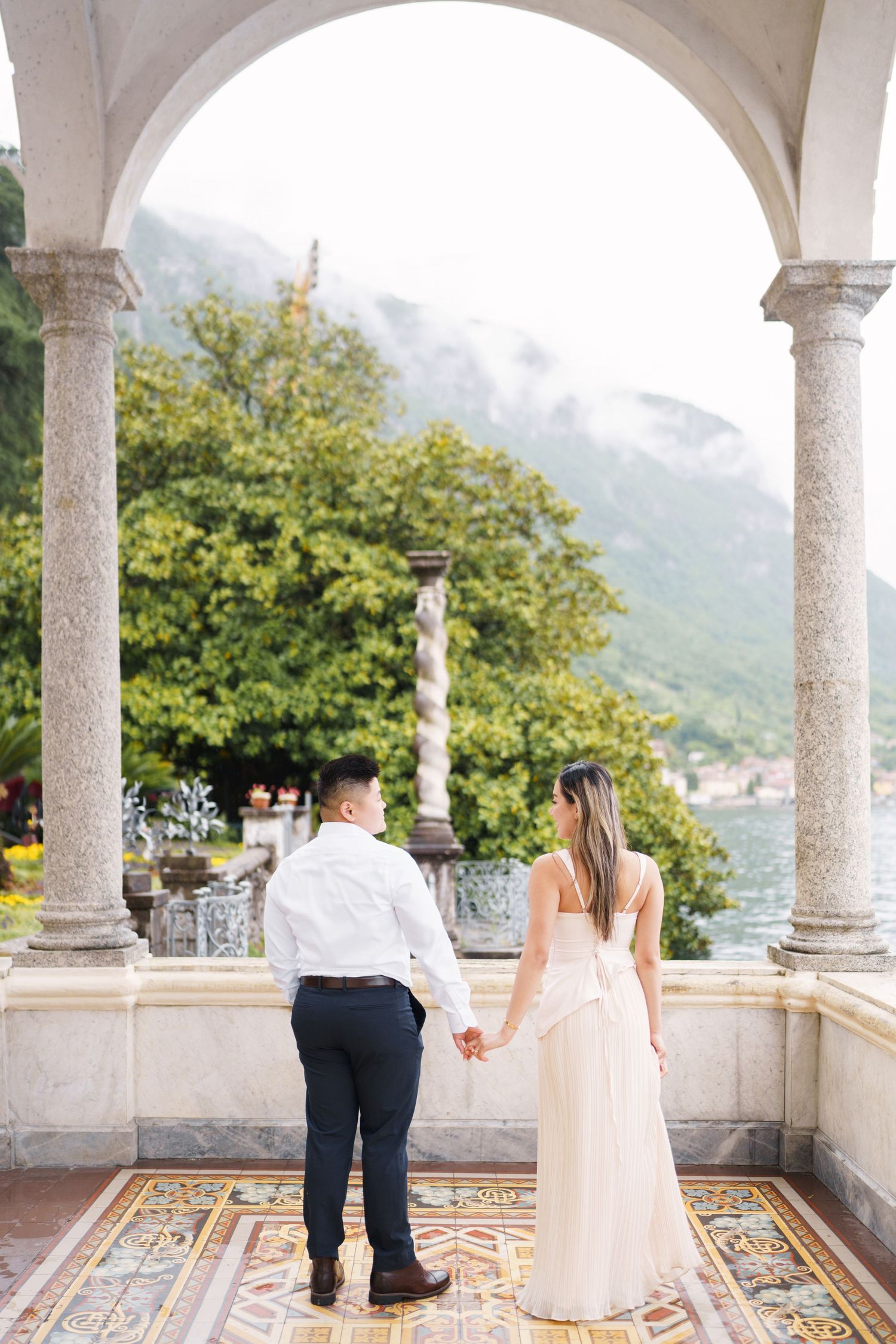 Lake Como proposal photographer capturing surprise engagement at Villa Monastero in Varenna