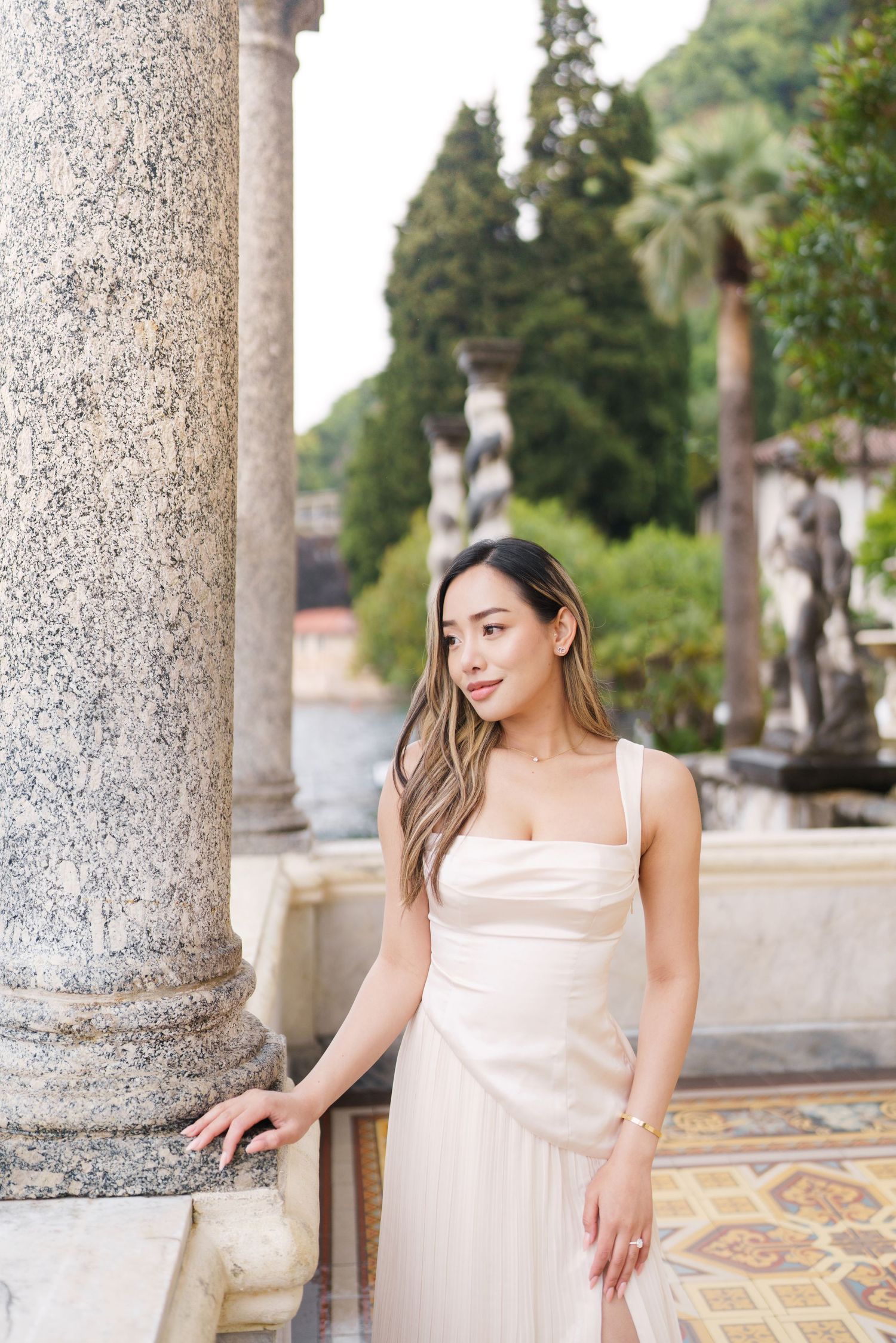 Lake Como proposal photographer capturing surprise engagement at Villa Monastero in Varenna