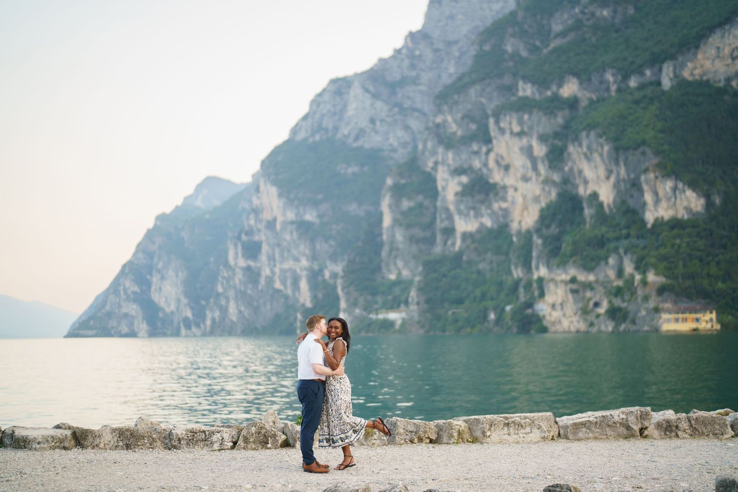 Emotional reaction during a surprise proposal beside Lake Garda in Riva del Garda