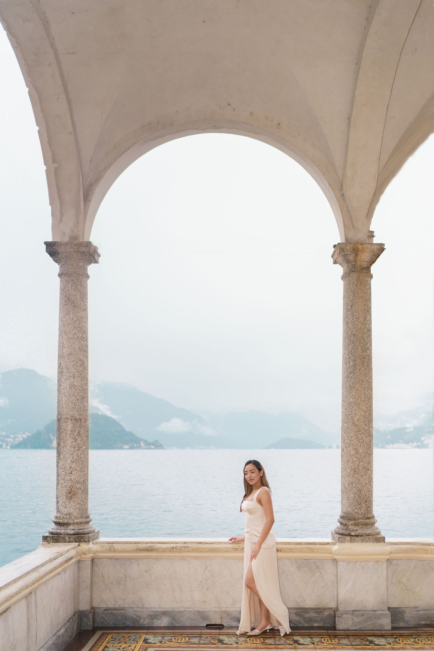 Lake Como proposal photographer capturing surprise engagement at Villa Monastero in Varenna