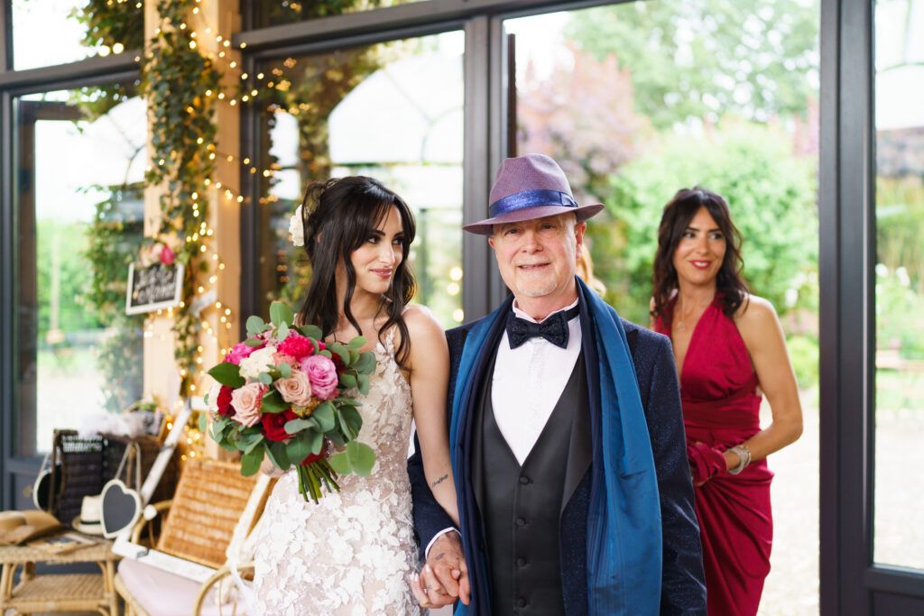 Wedding reception venue decorated with elegant floral arrangements and formal attire.