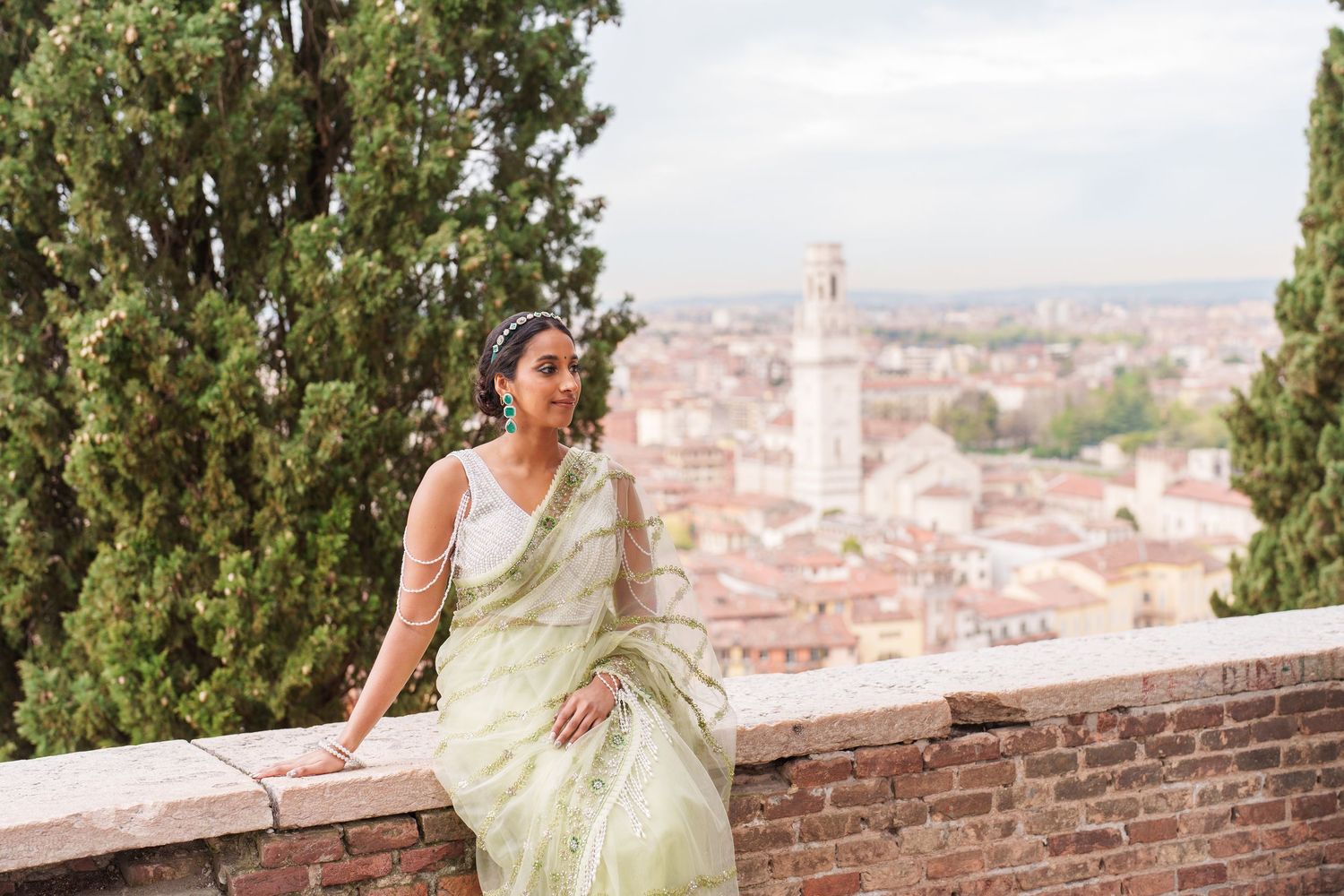 A scenic view of Florence, Italy with the iconic Duomo cathedral and historic architecture visible from an elevated viewpoint.