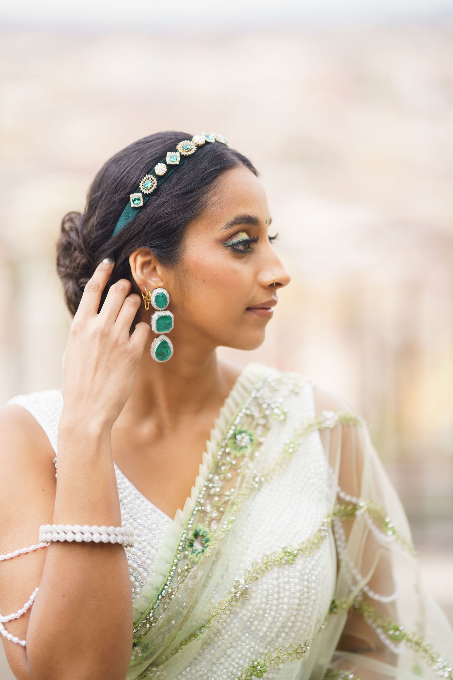 A woman in traditional Indian attire adorned with turquoise jewelry poses elegantly in a series of profile shots.