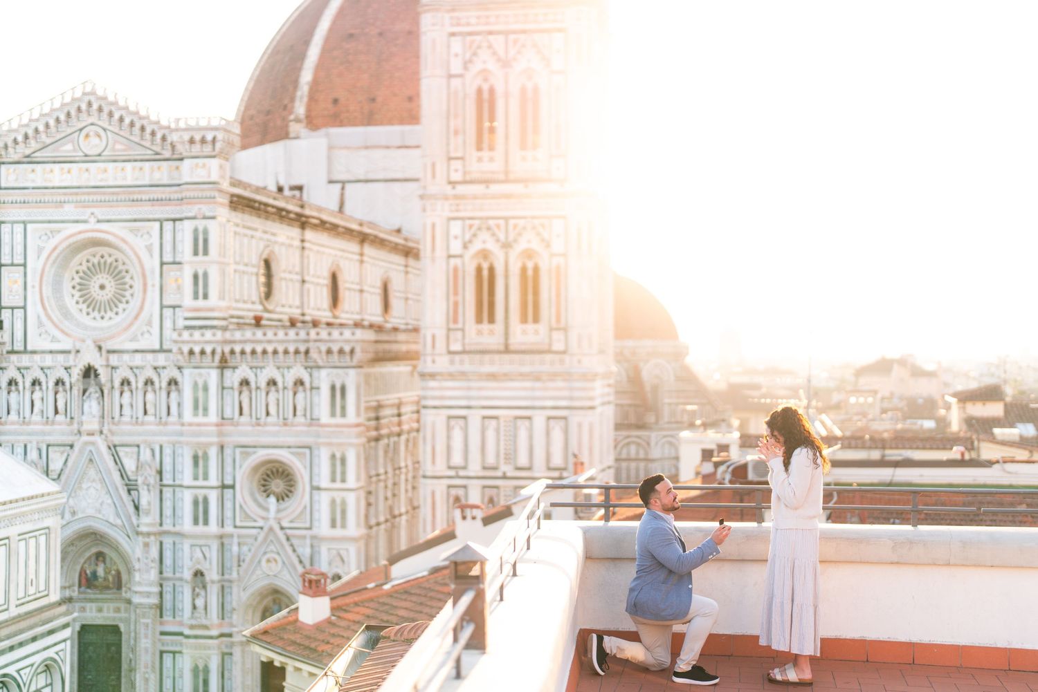 Scenic view of Florence Cathedral and Duomo at sunset with golden light illuminating the historic architecture.