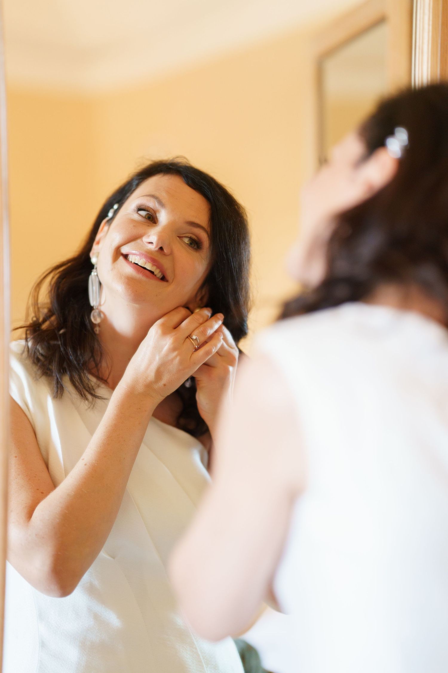 Candid sequence showing joyful laughter and natural expressions in a warmly lit indoor setting.