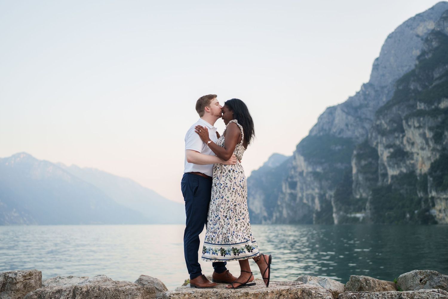 Emotional reaction during a surprise proposal beside Lake Garda in Riva del Garda