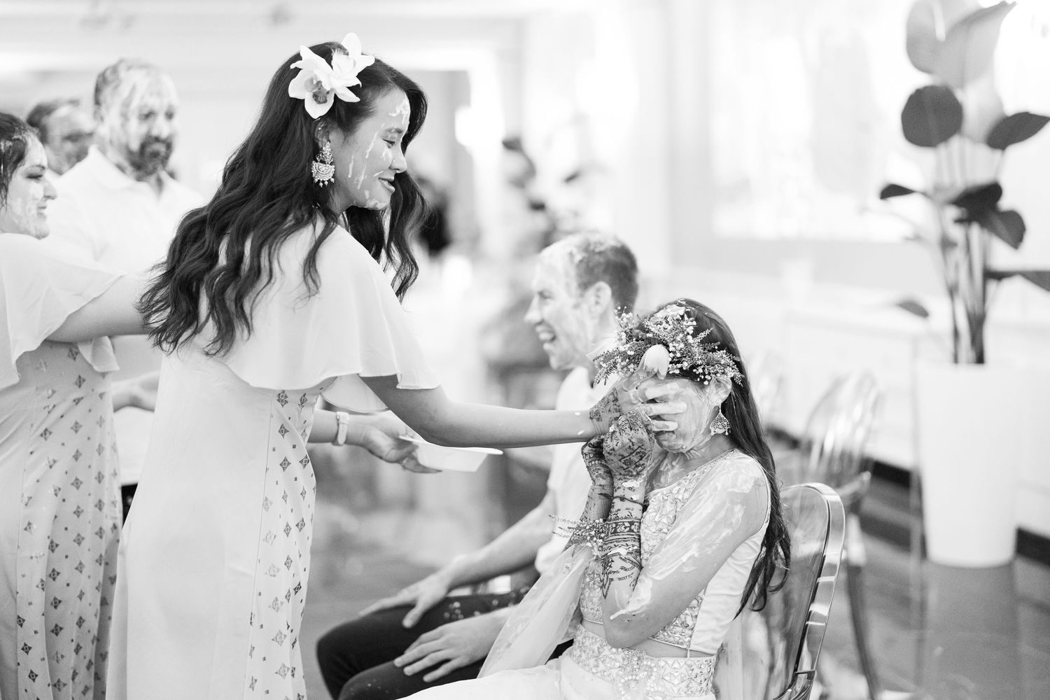 Black and white candid shots capturing joyful moments at an elegant wedding celebration.