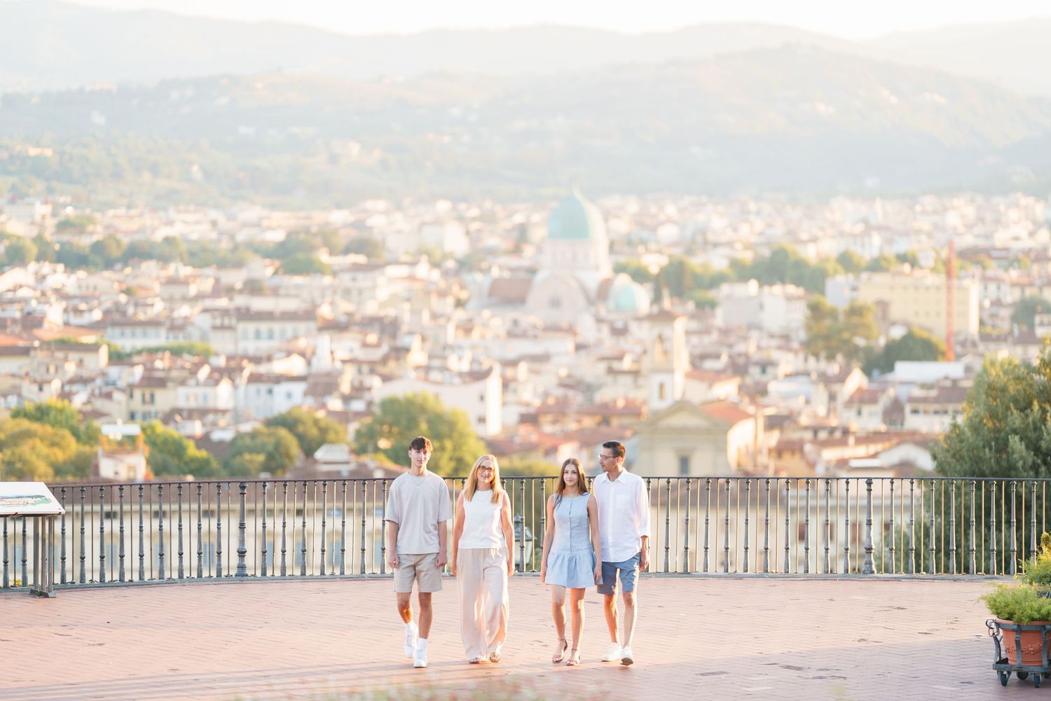 photographer FlorenceA scenic panoramic view of Florence, Italy with historic buildings and architecture stretching across the cityscape.
