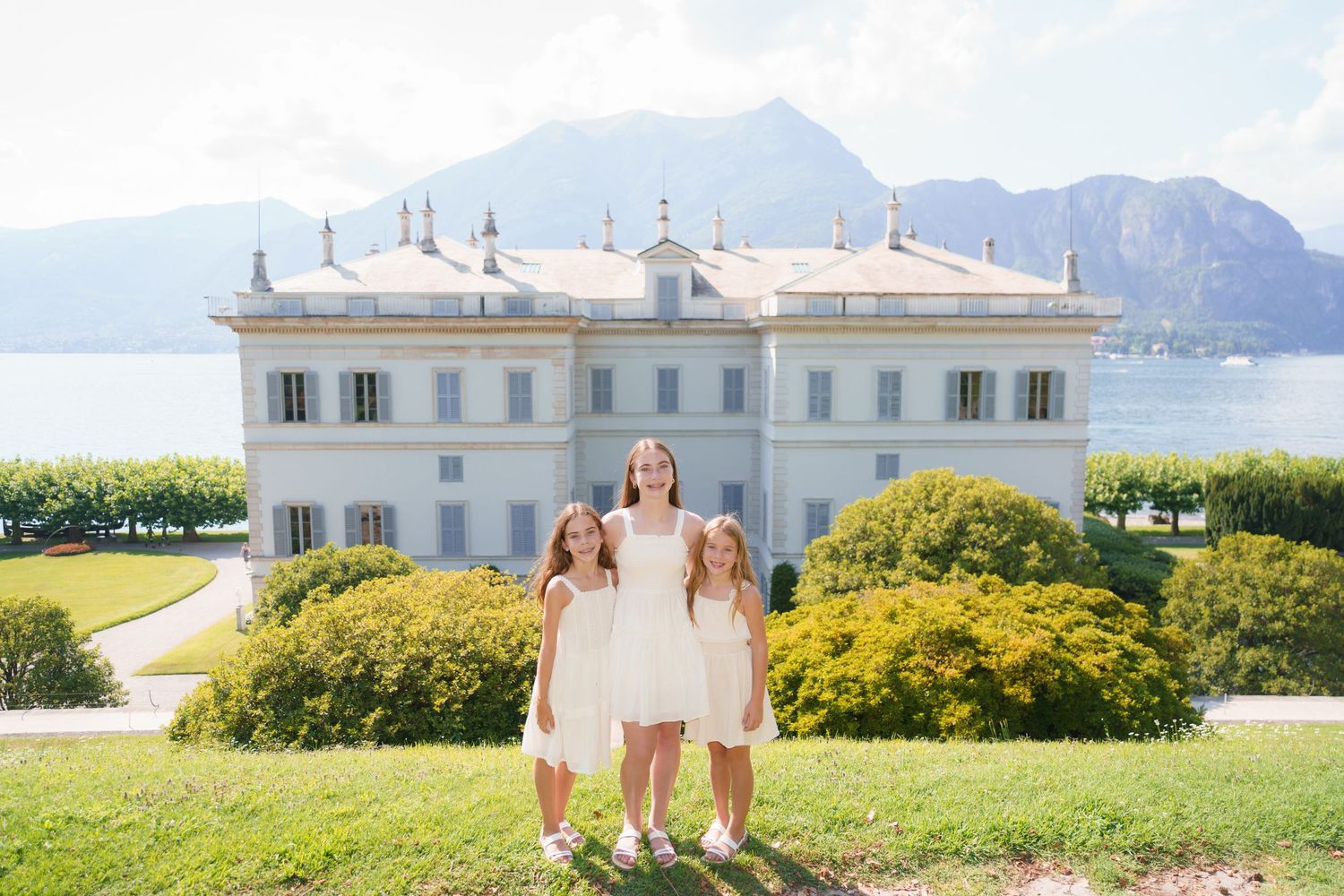 Family portrait at Villa Melzi with Lake Como mountains in Bellagio