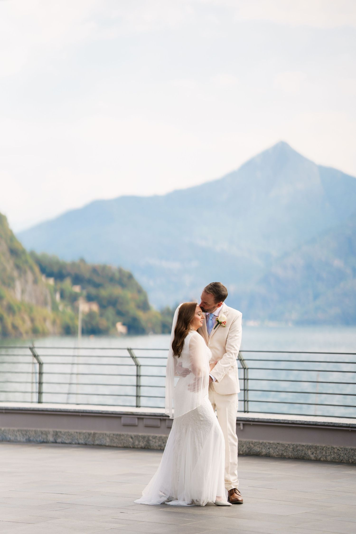 Newly married couple enjoying a quiet moment beside Lake Como