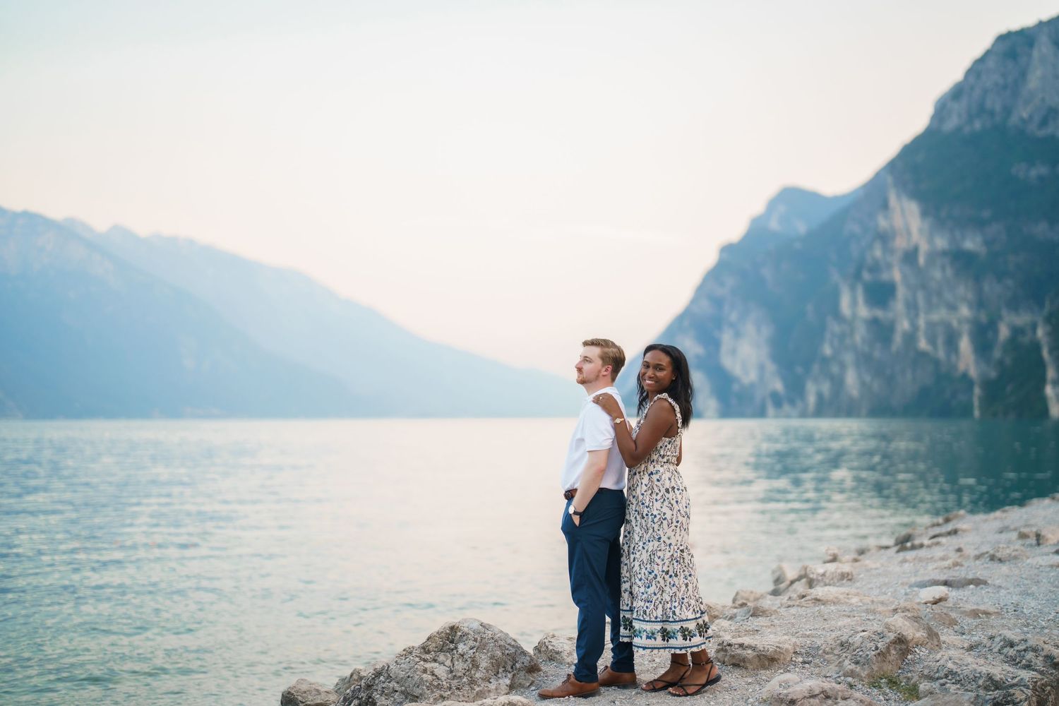 Emotional reaction during a surprise proposal beside Lake Garda in Riva del Garda