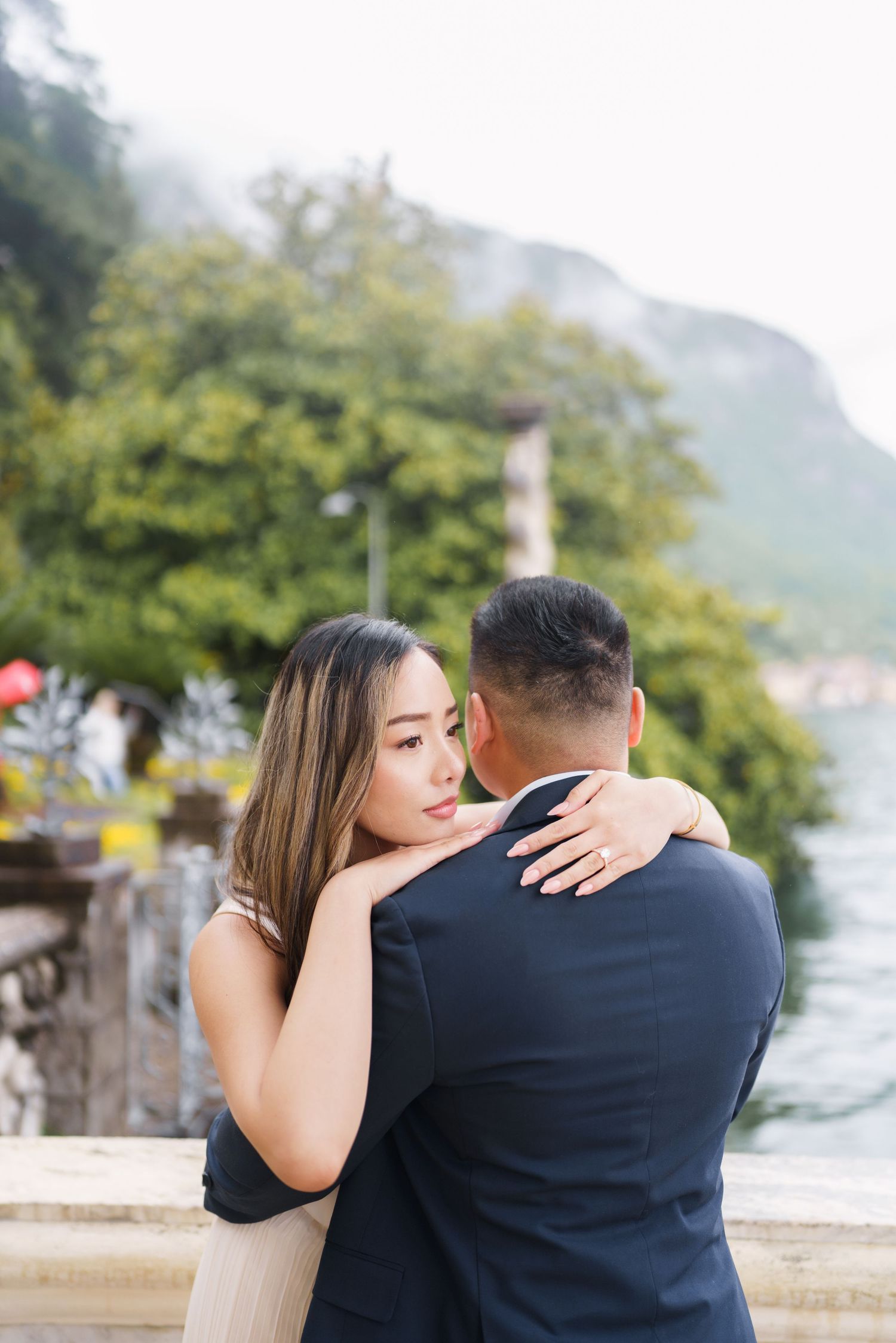 Lake Como proposal photographer capturing surprise engagement at Villa Monastero in Varenna