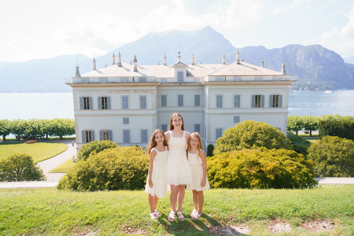 Family portrait at Villa Melzi with Lake Como mountains in Bellagio