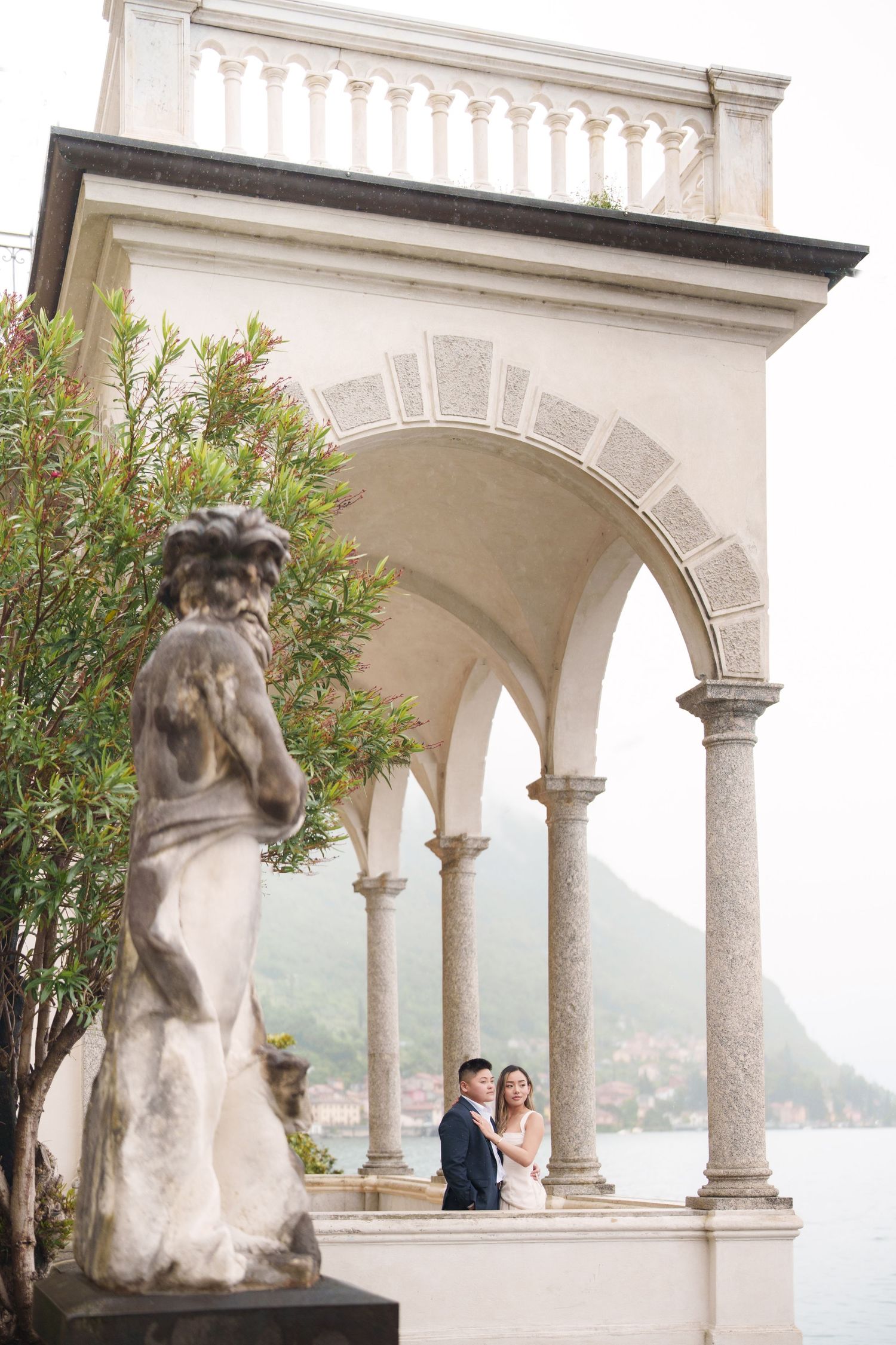 Lake Como proposal photographer capturing surprise engagement at Villa Monastero in Varenna