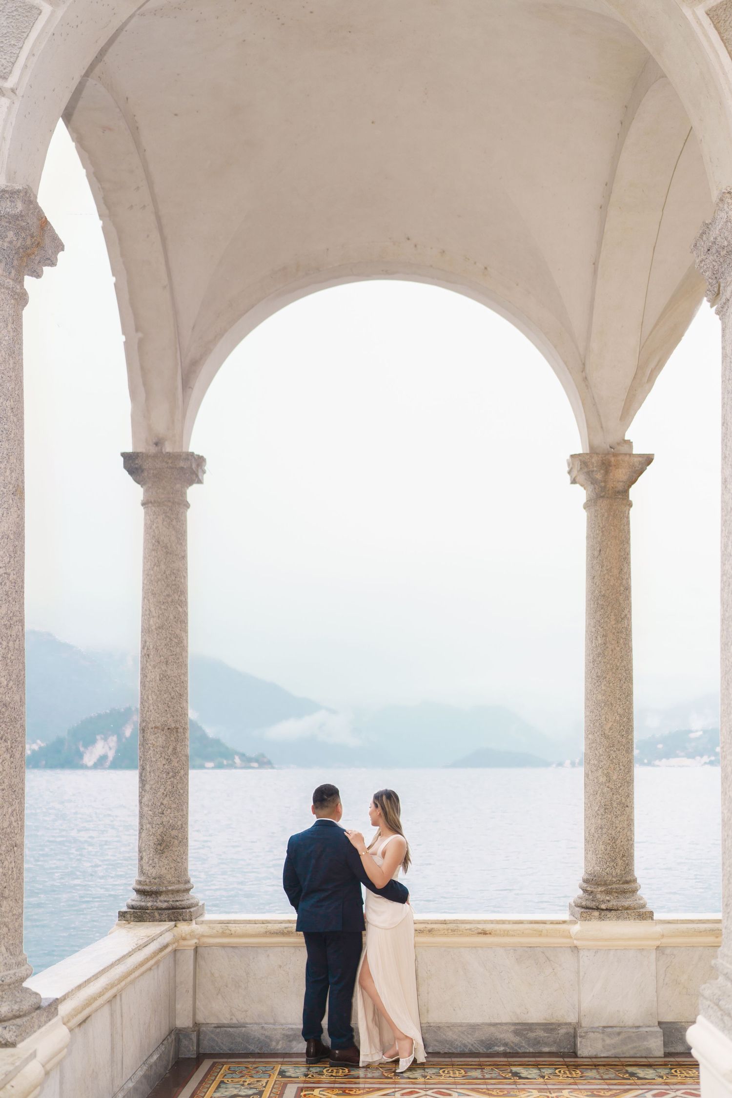 Lake Como proposal photographer capturing surprise engagement at Villa Monastero in Varenna
