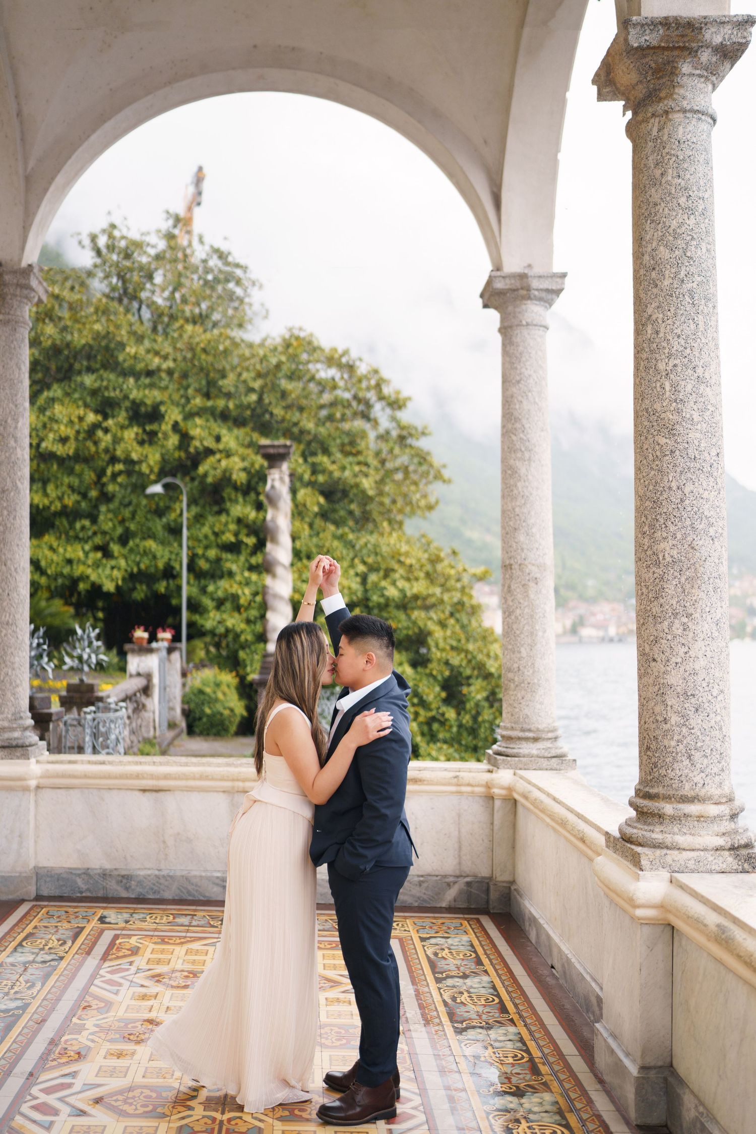Lake Como proposal photographer capturing surprise engagement at Villa Monastero in Varenna