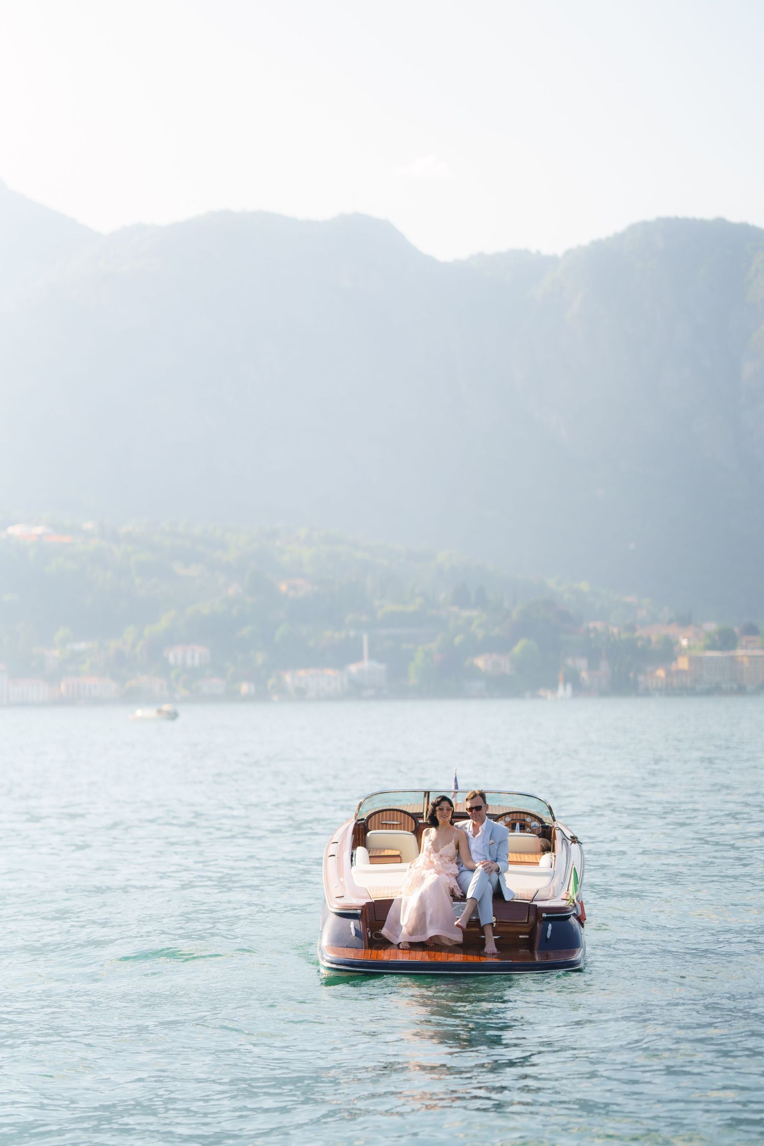 luxury lake como photoshoot with classic wooden boat