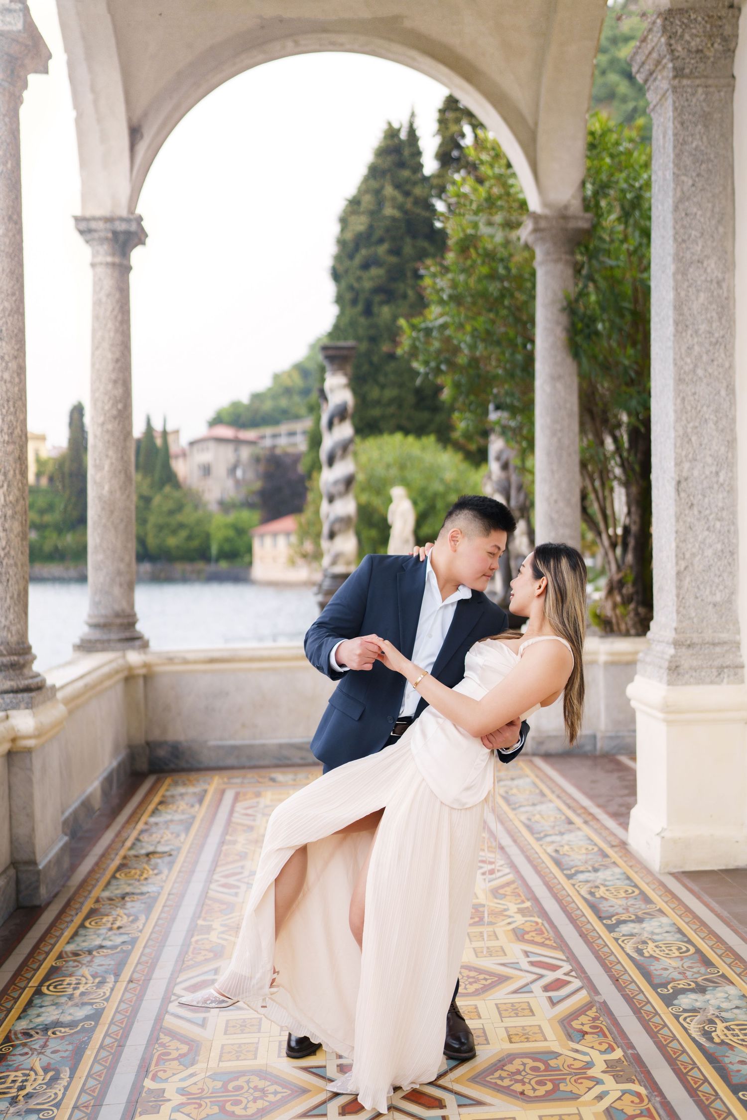 Lake Como proposal photographer capturing surprise engagement at Villa Monastero in Varenna