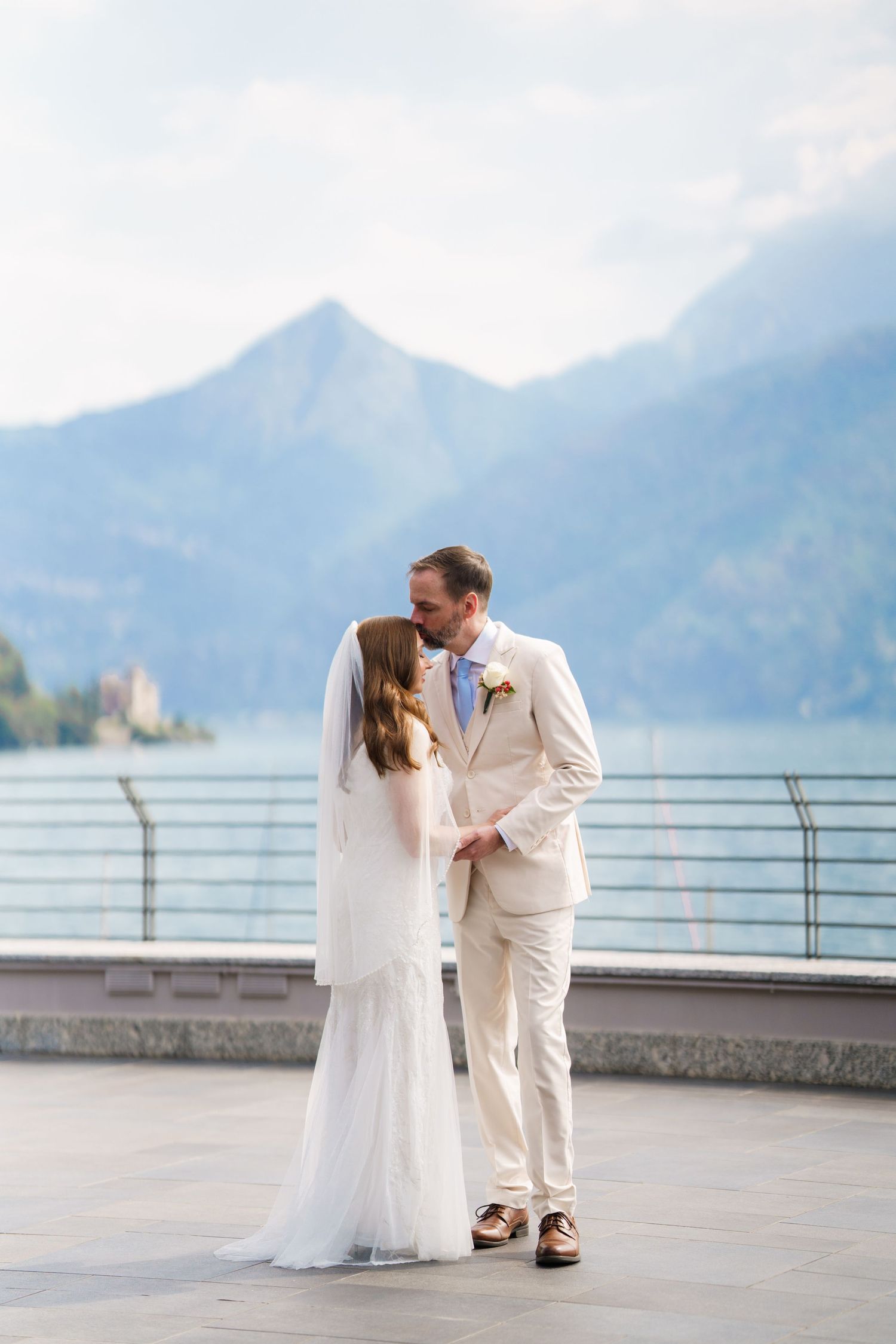 Newly married couple enjoying a quiet moment beside Lake Como