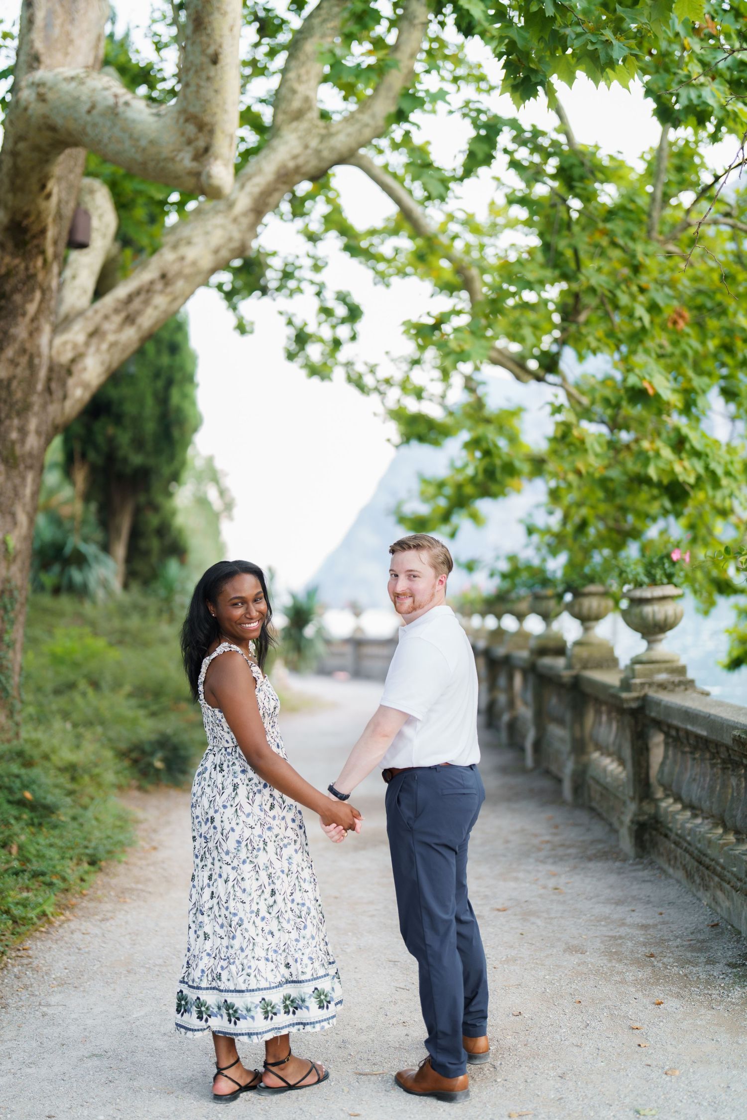 Emotional reaction during a surprise proposal beside Lake Garda in Riva del Garda