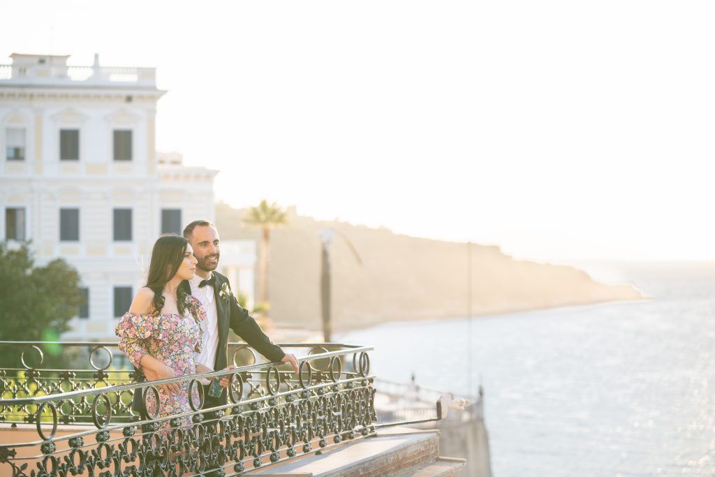 Scenic terrace overlooking Mediterranean coastline with decorative railings.