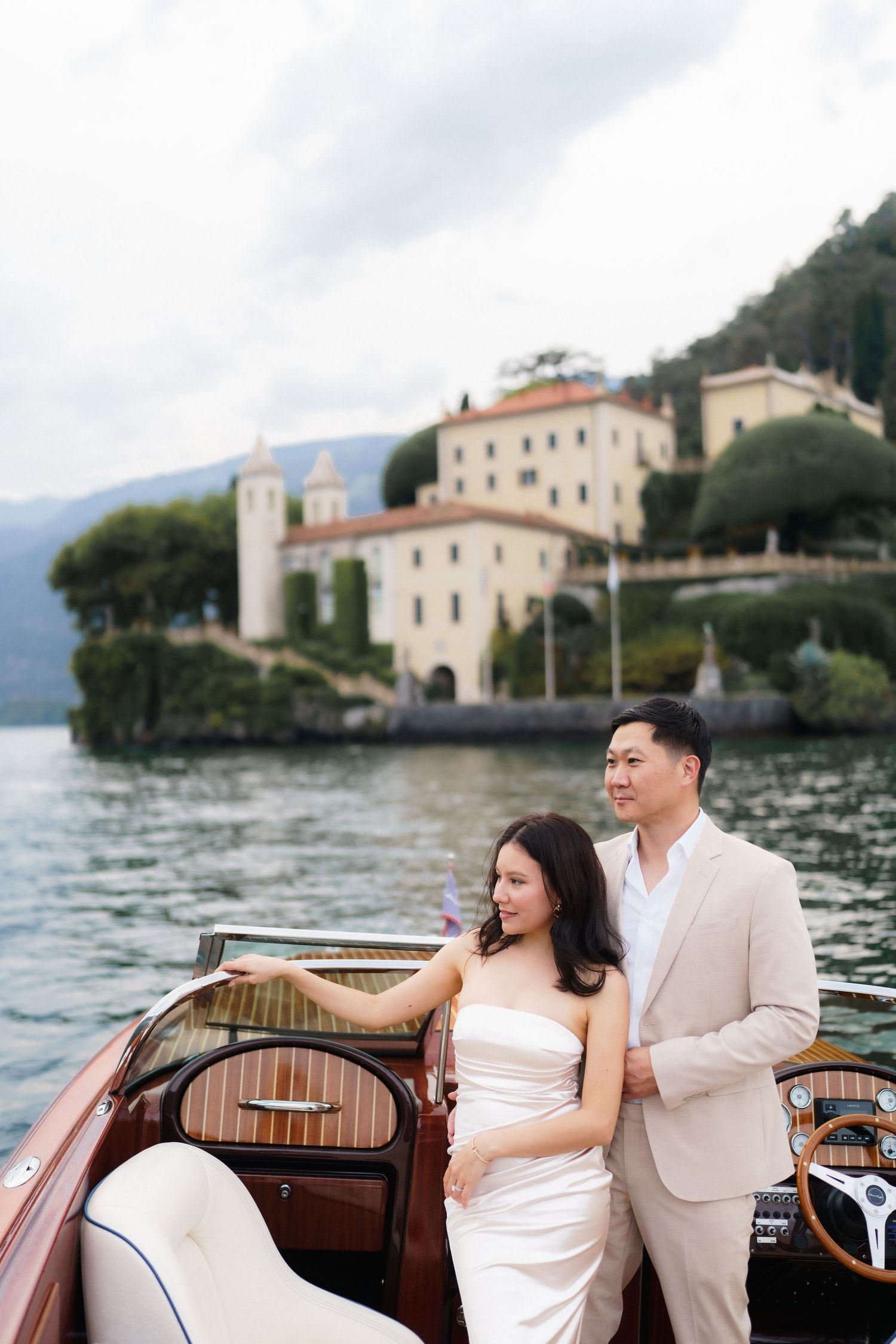 A romantic boat ride along Lake Como with historic Italian villas and architecture in the background.