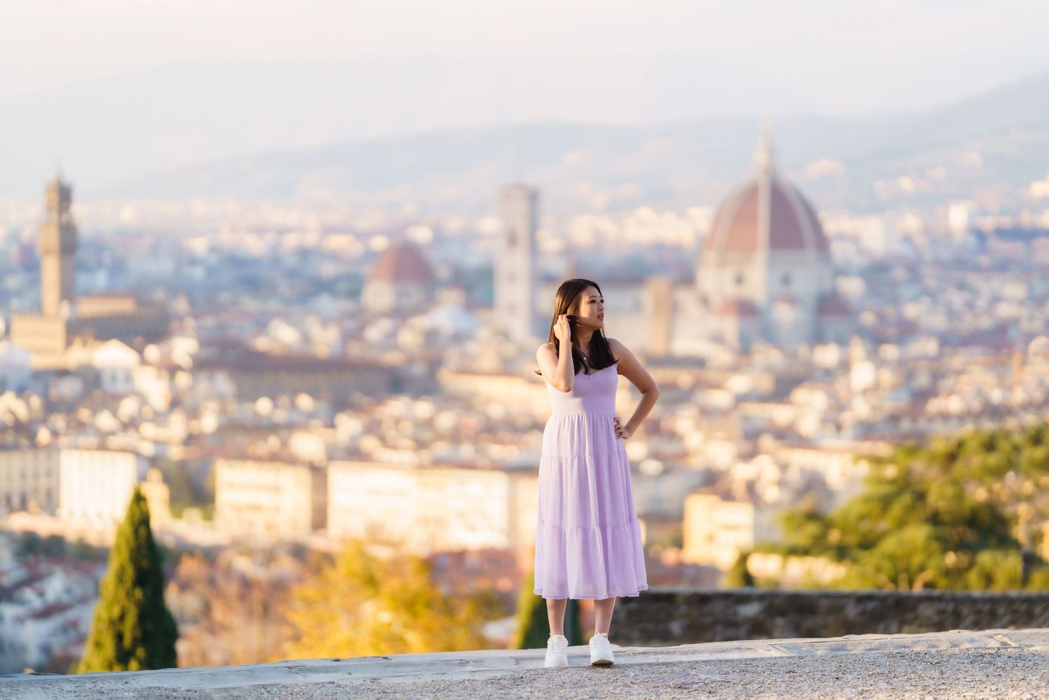 Panoramic view of Florence, Italy skyline at sunset with the iconic Duomo cathedral dome dominating the cityscape.