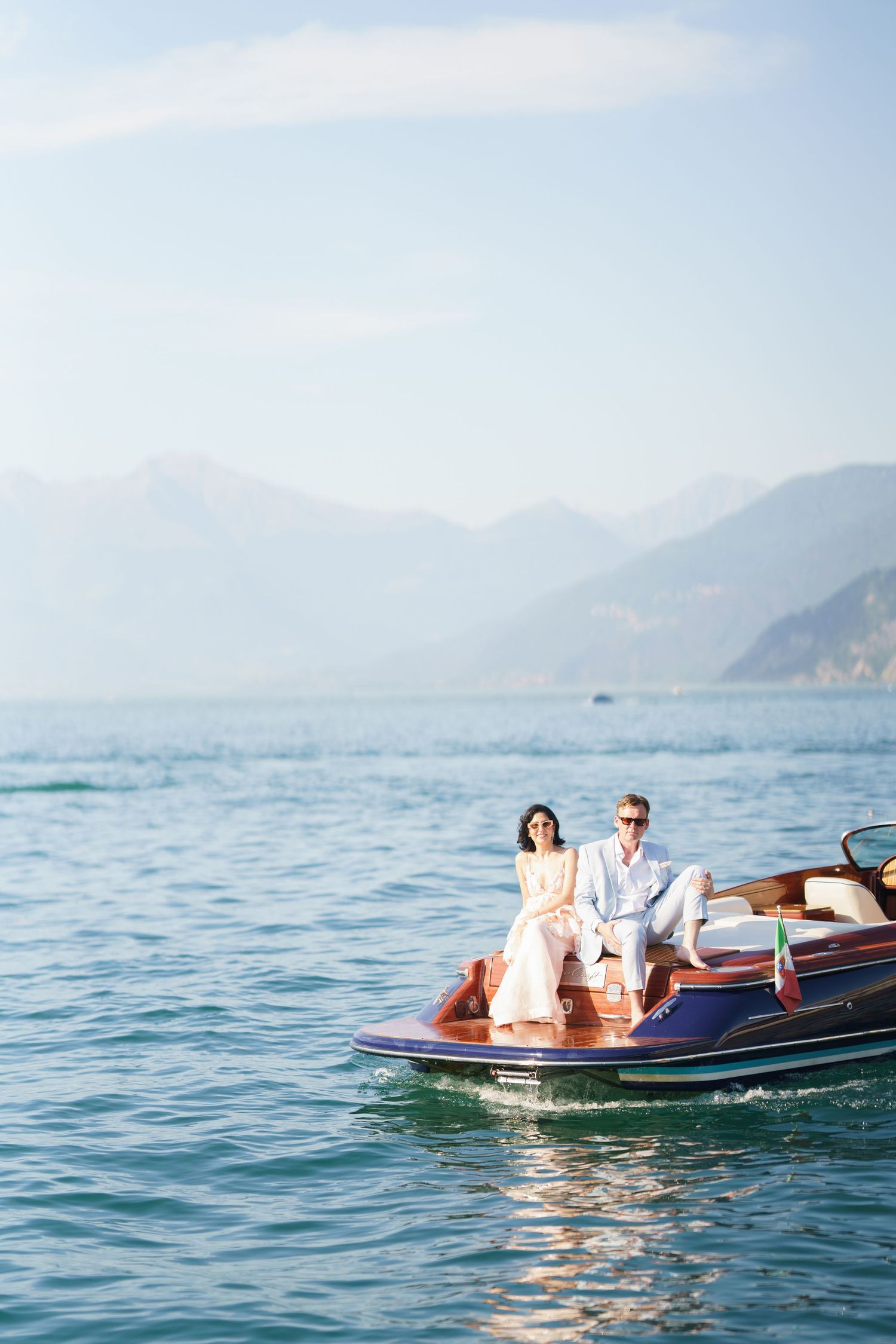 luxury lake como photoshoot with classic wooden boat