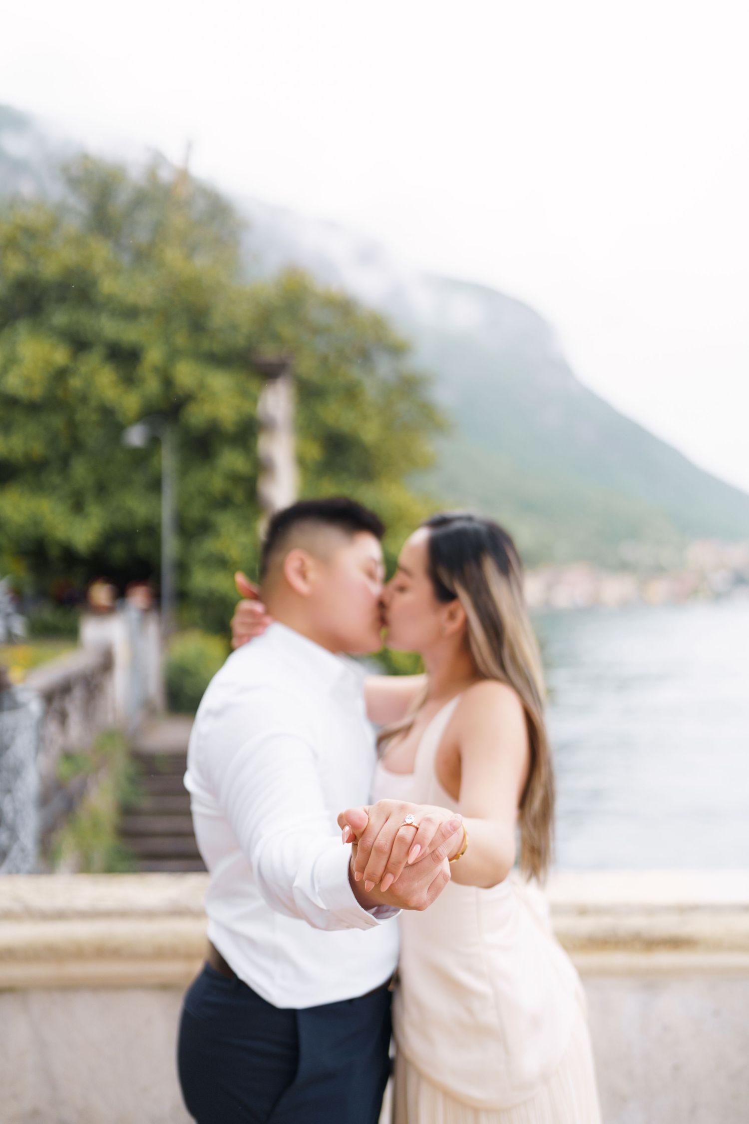 Lake Como proposal photographer capturing surprise engagement at Villa Monastero in Varenna