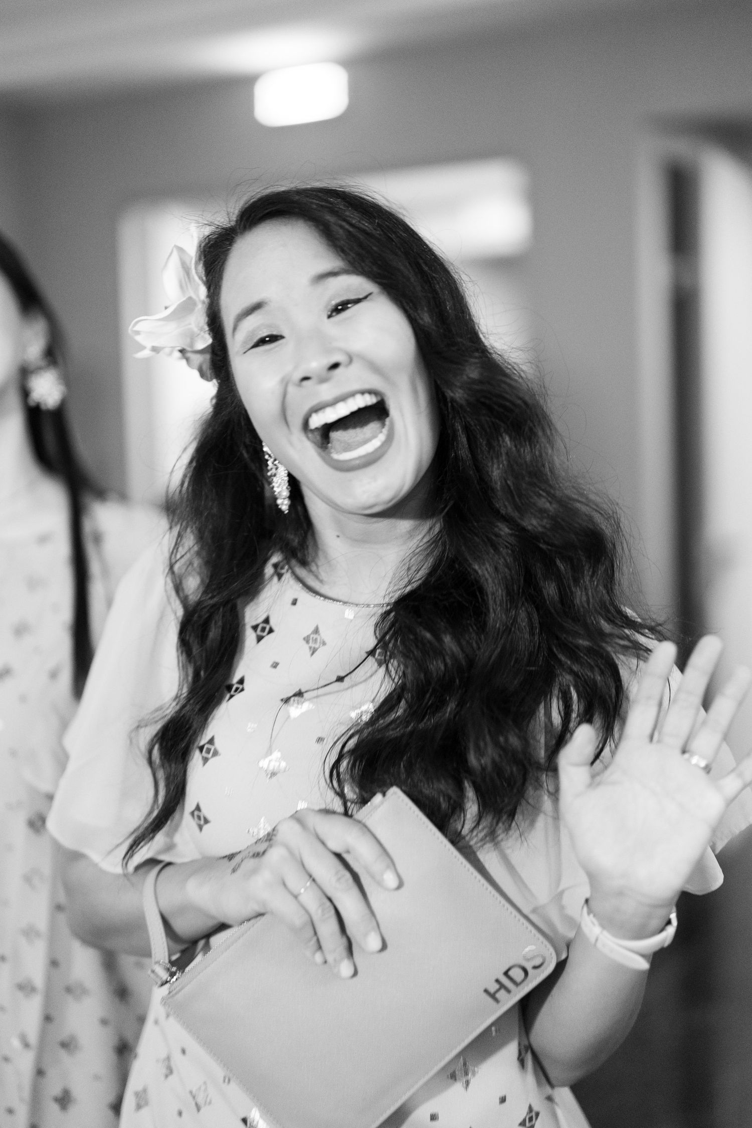 Candid sequence showing animated expressions and gestures in a hallway setting.
