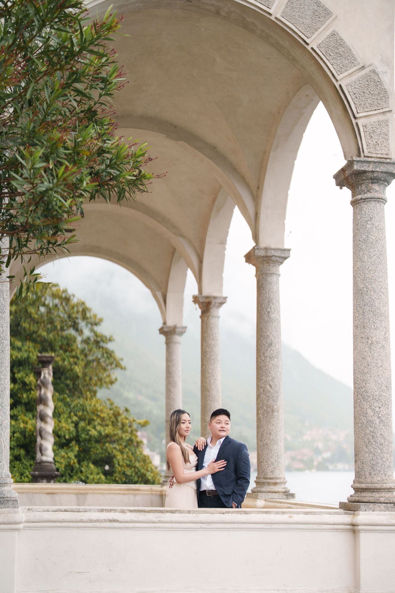 Lake Como proposal photographer capturing surprise engagement at Villa Monastero in Varenna