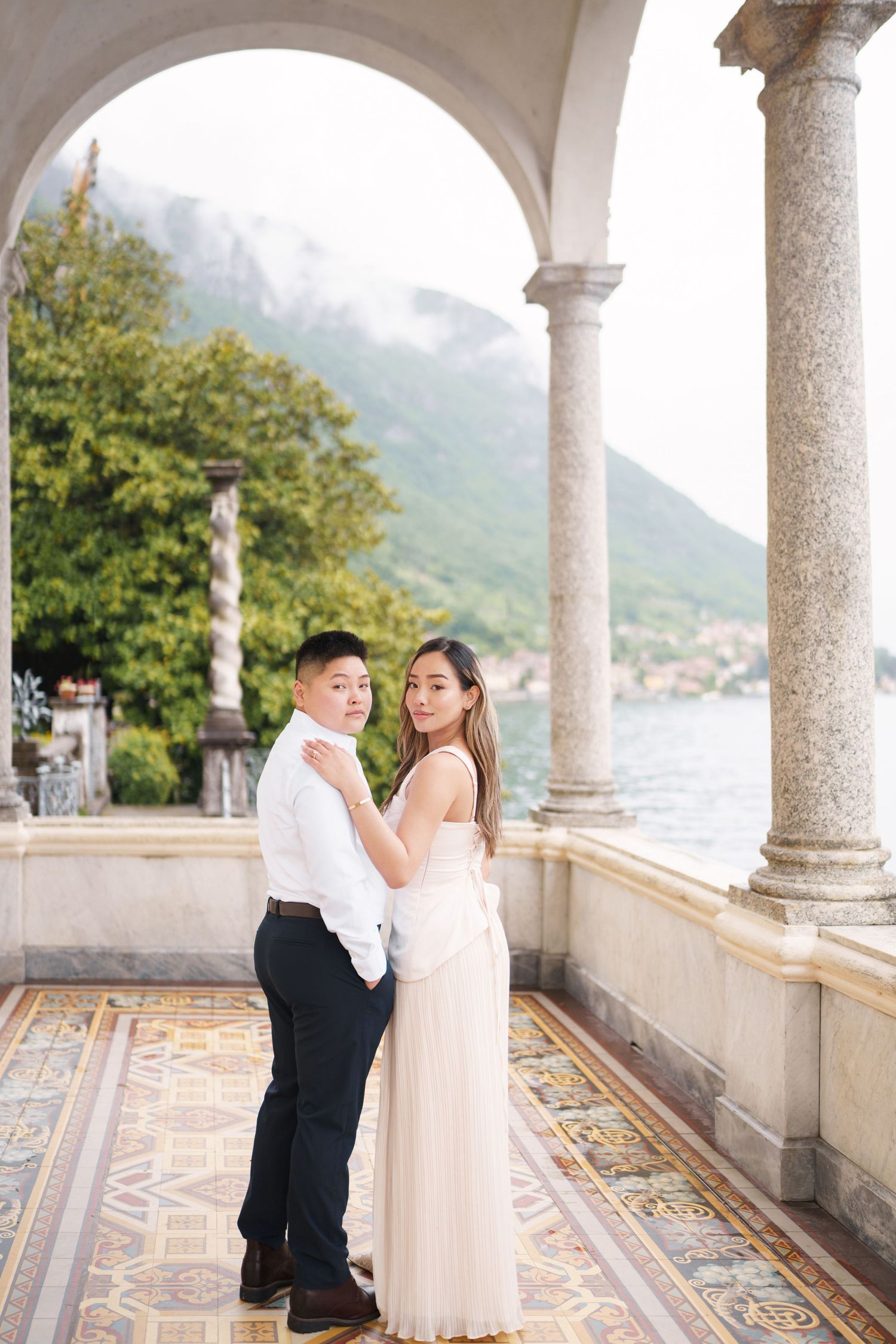 Lake Como proposal photographer capturing surprise engagement at Villa Monastero in Varenna