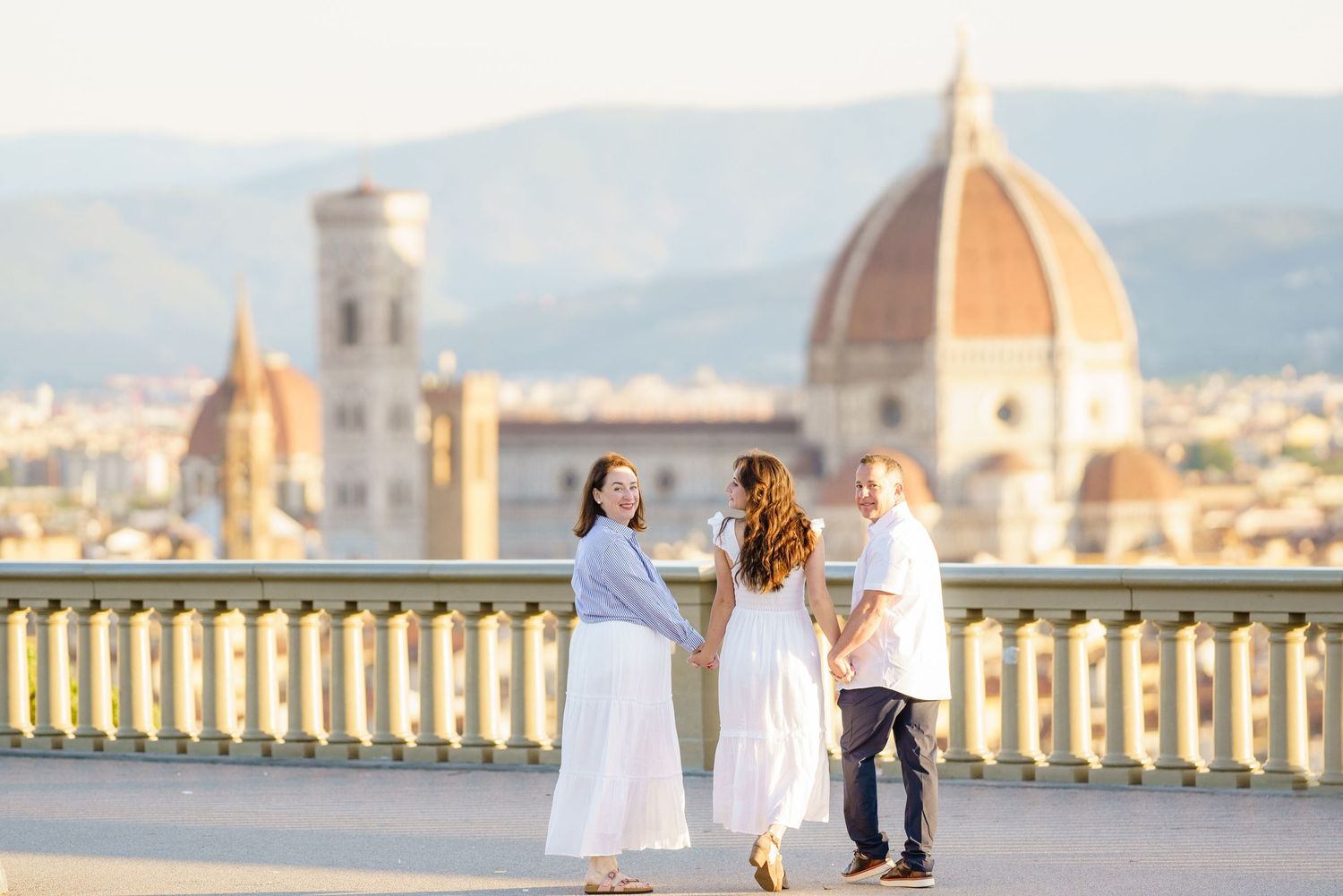 A series of wedding photos taken at iconic locations in Florence, Italy with the Duomo cathedral in the background.