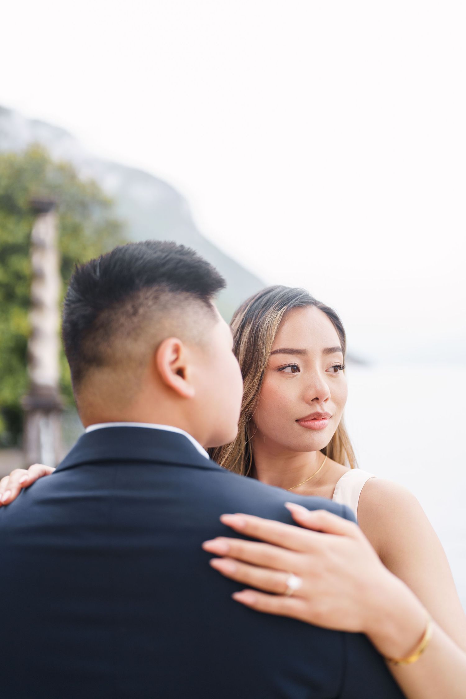 Lake Como proposal photographer capturing surprise engagement at Villa Monastero in Varenna