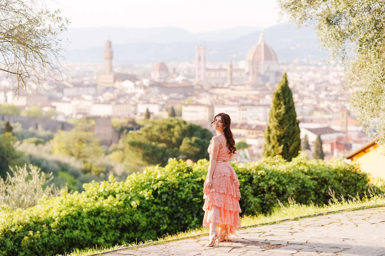 Scenic panoramic view of Florence Italy cityscape with historic architecture and Duomo cathedral visible from hilltop viewpoint.