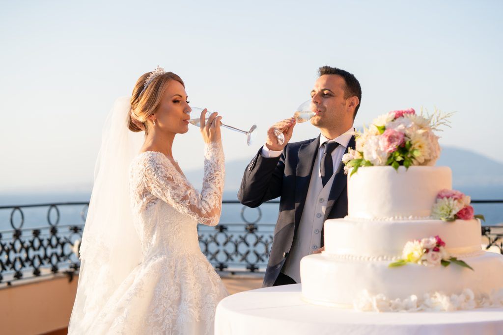Elegant wedding celebration on a luxury terrace with stunning Mediterranean views.