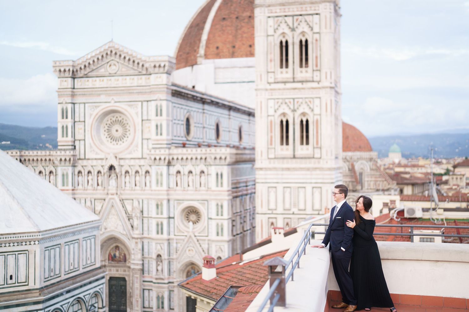 A romantic moment overlooking the historic Florence Cathedral with its iconic Renaissance dome and marble facade in Italy.