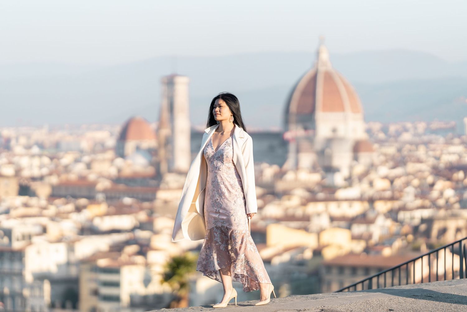 Scenic panoramic view of Florence, Italy with the iconic Duomo cathedral dome rising above the historic cityscape.